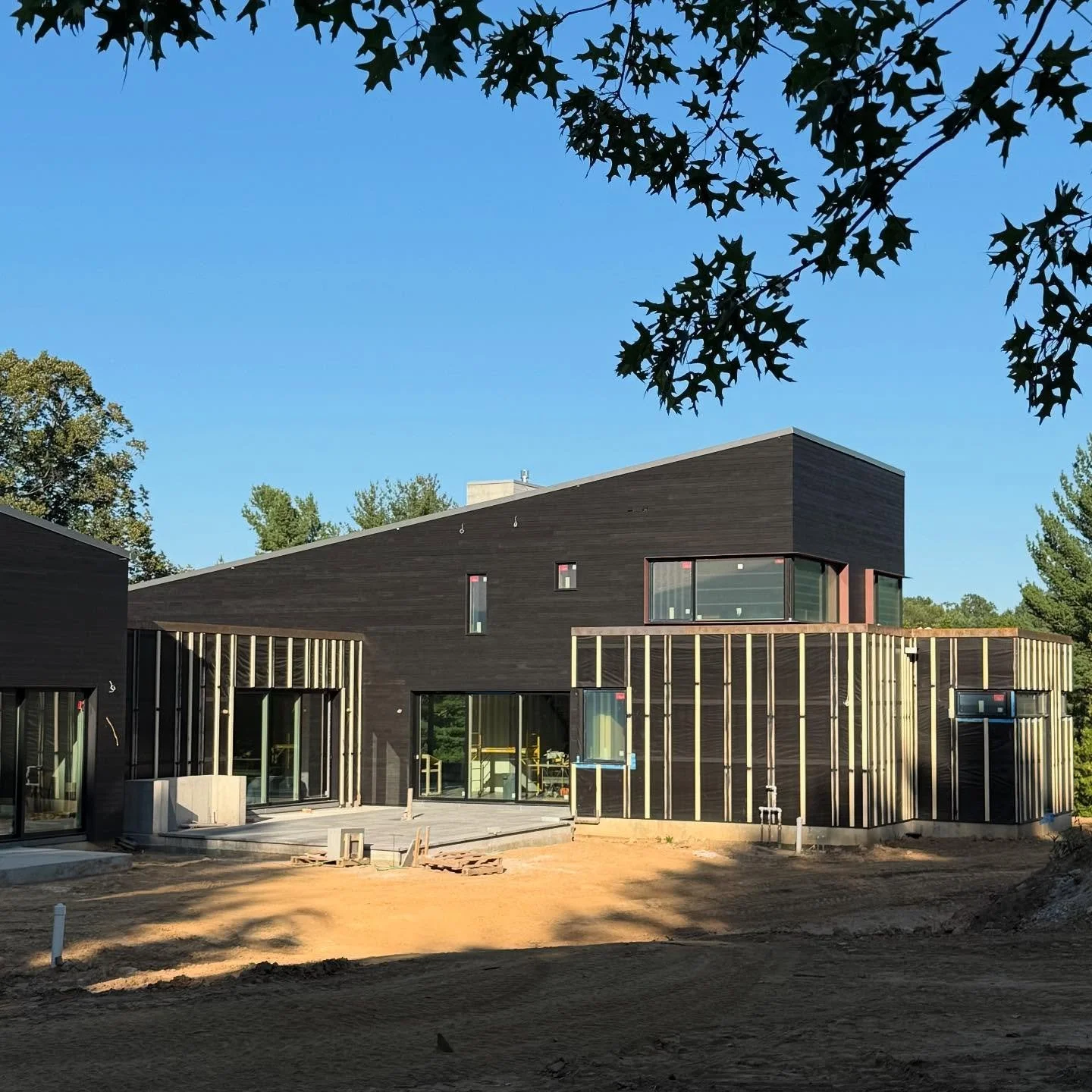 The &quot;Clean Slate&quot; project features wedges encased in charred wood, connected by steel structures that will gradually oxidize and form a patina.