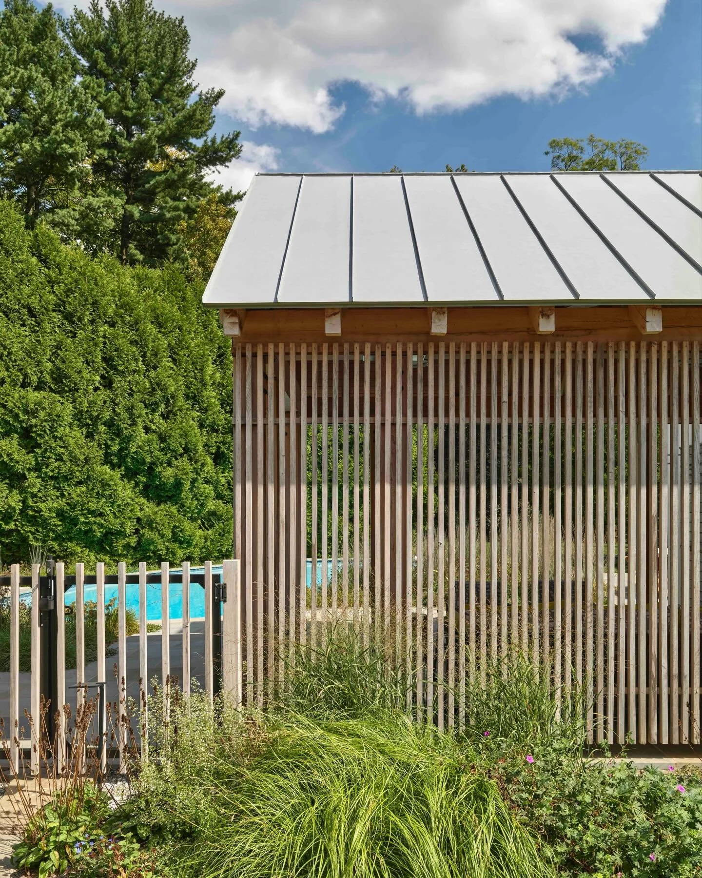 The pool house acts as a filter, framing water within a naturalized garden. #gardens #poolhouse #pool
