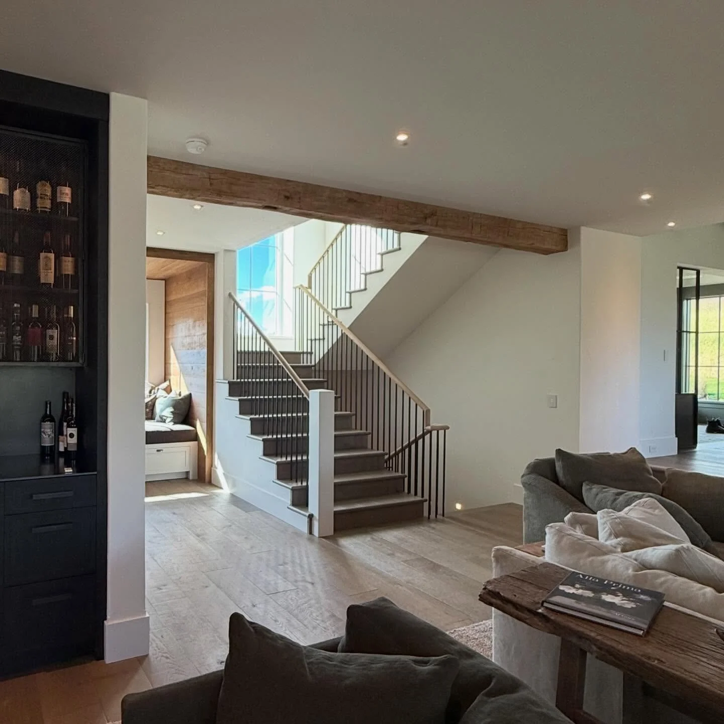 A small cottage, centered on a stair that organizes both movement and light. The window bench isn&rsquo;t an afterthought&hellip; it&rsquo;s the pause point, where structure gives way to stillness.

Framed views. Controlled light. Intentional simplic
