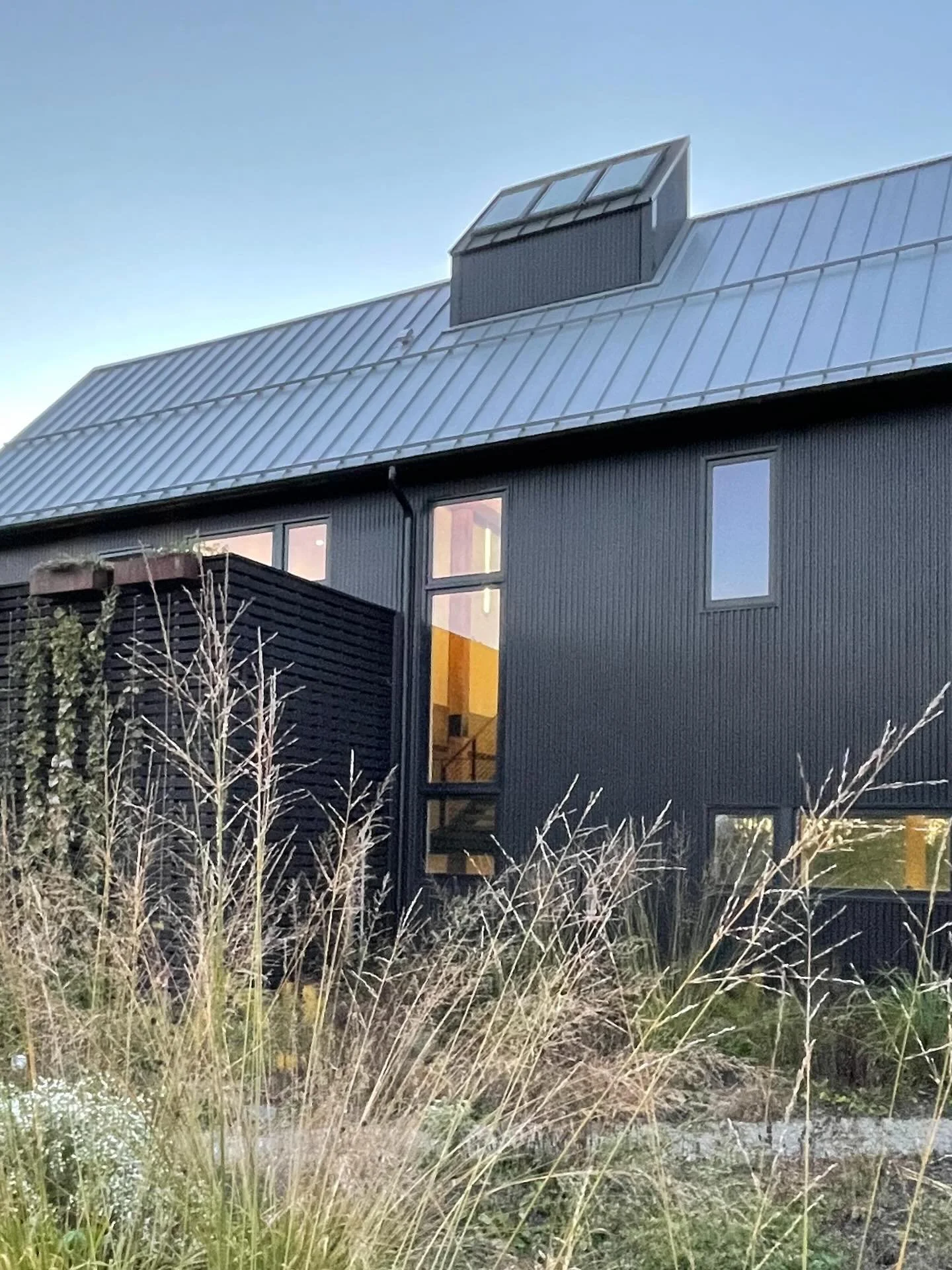 A central stair becomes the lungs of the house.

Operable skylights above the three-story volume create a thermal chimney&mdash;drawing fresh air in through lower windows and releasing warm air at the roof. Light, air, and structure work together to 