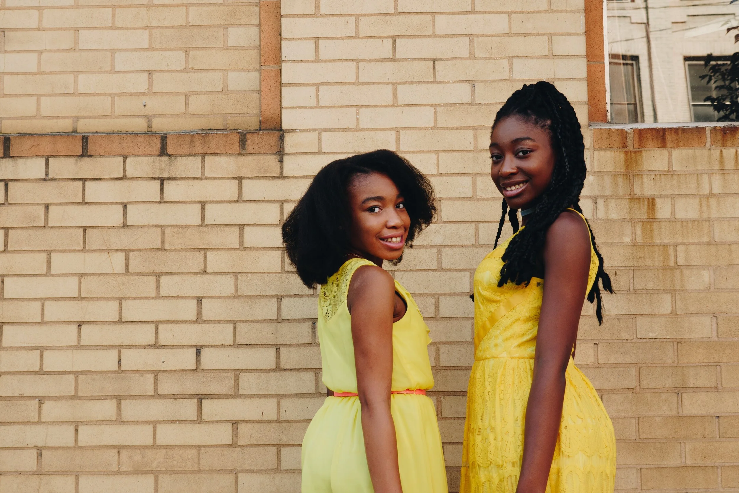 Two girls smiling together