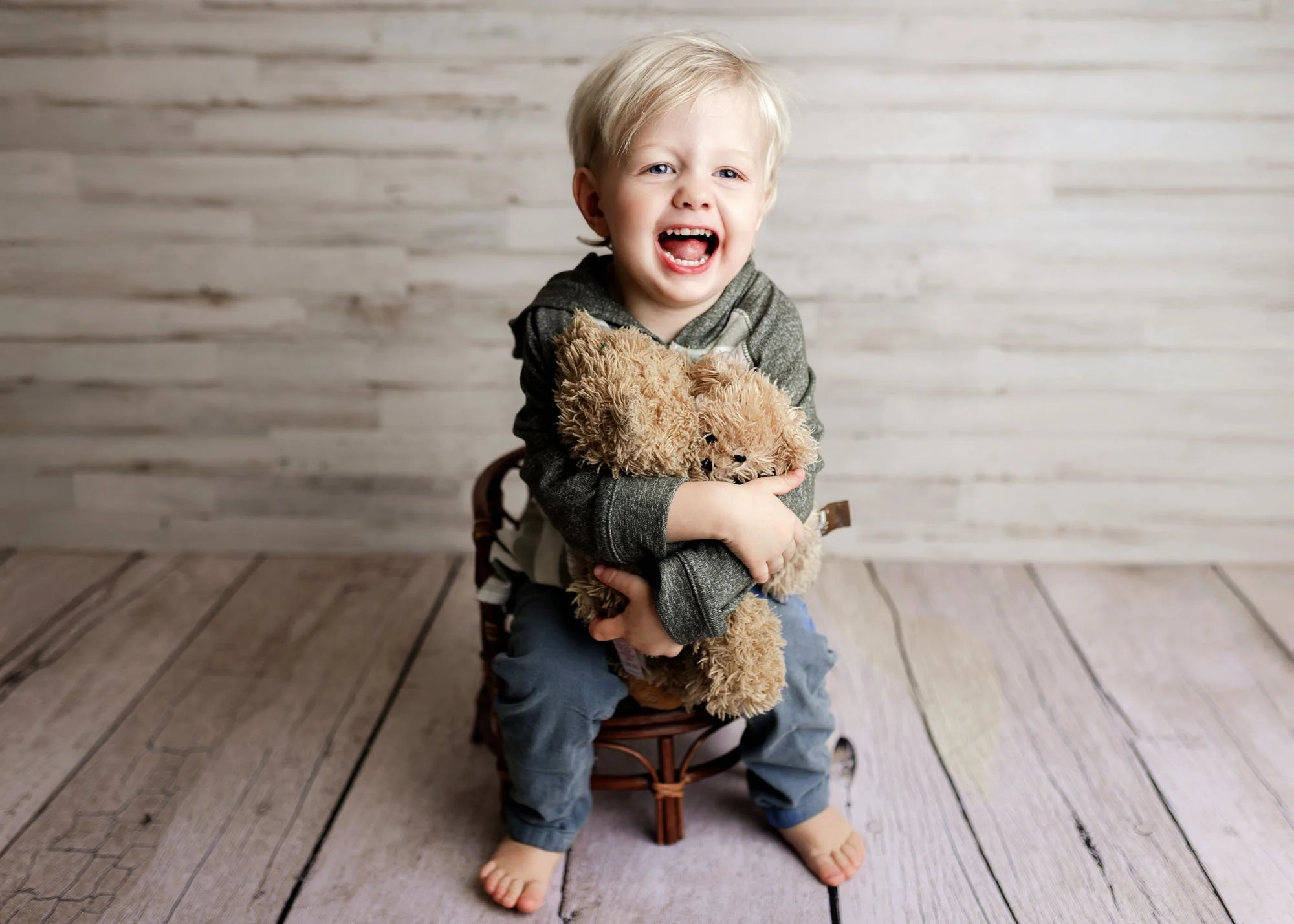 Studio milestone session with baby on chair or basket
