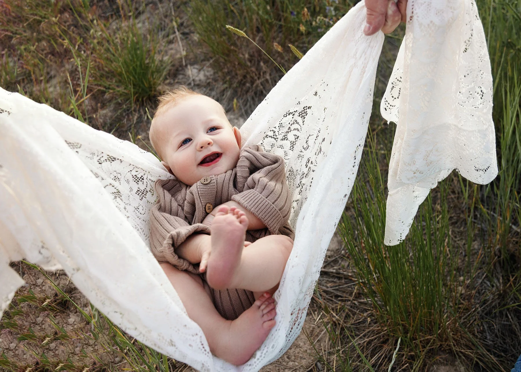 Parents tossing children into the air during playful session