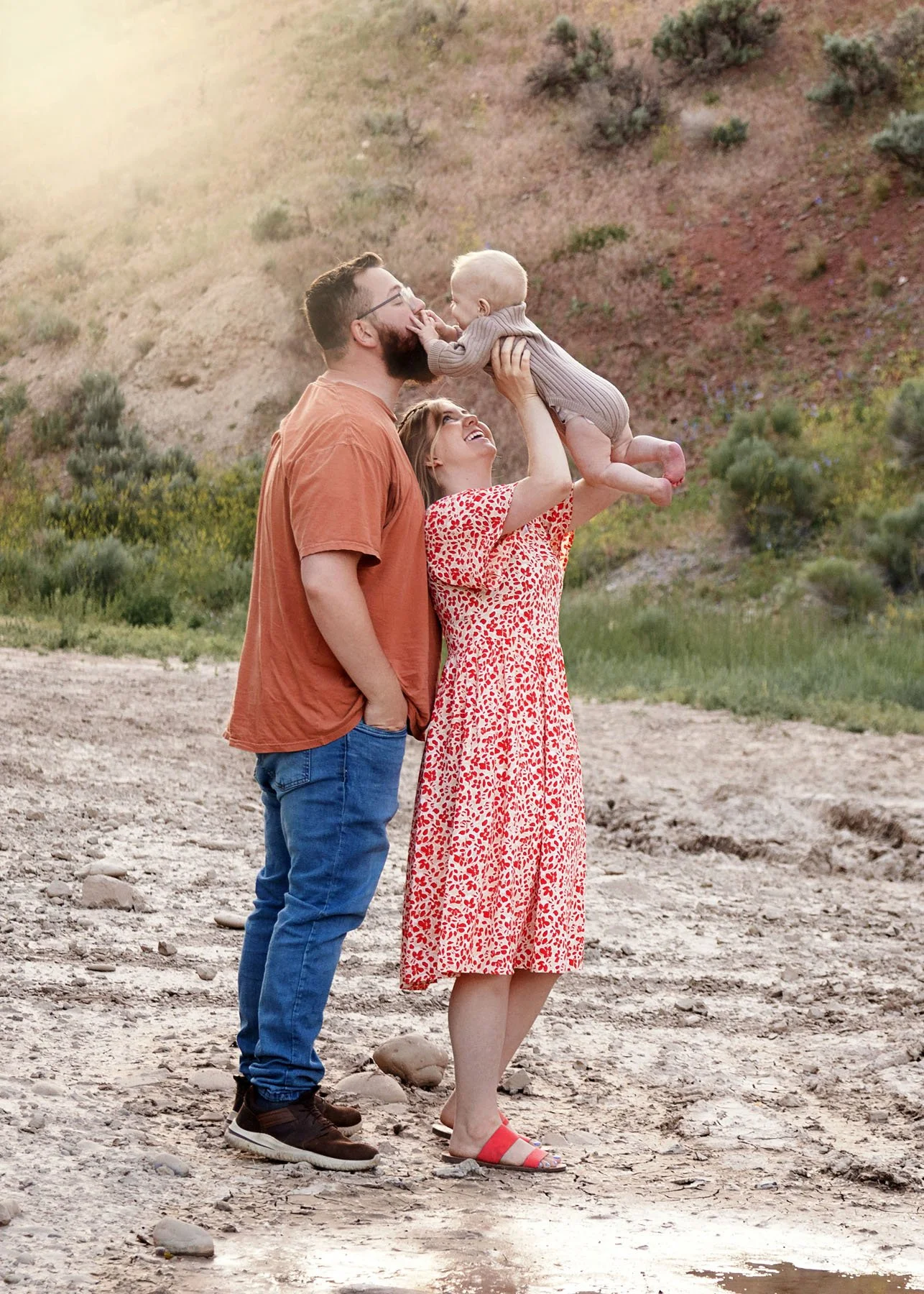 Parents tossing children into the air during playful session