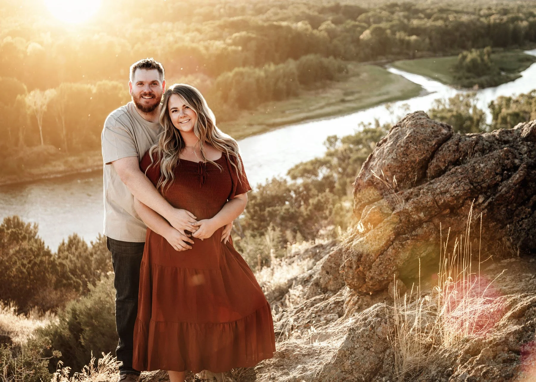 Family walking together on rocky river terrain in Idaho