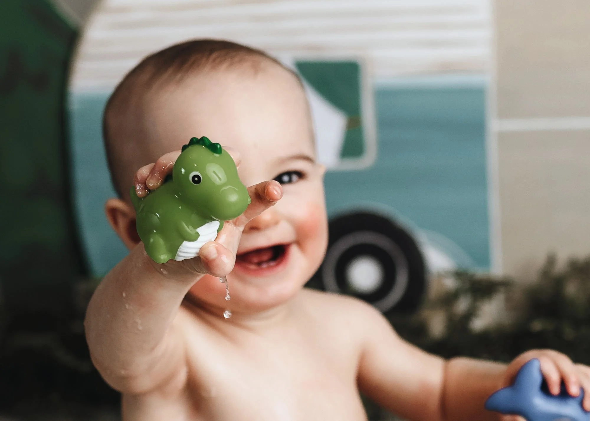 Baby enjoying camping-themed cake smash in studio