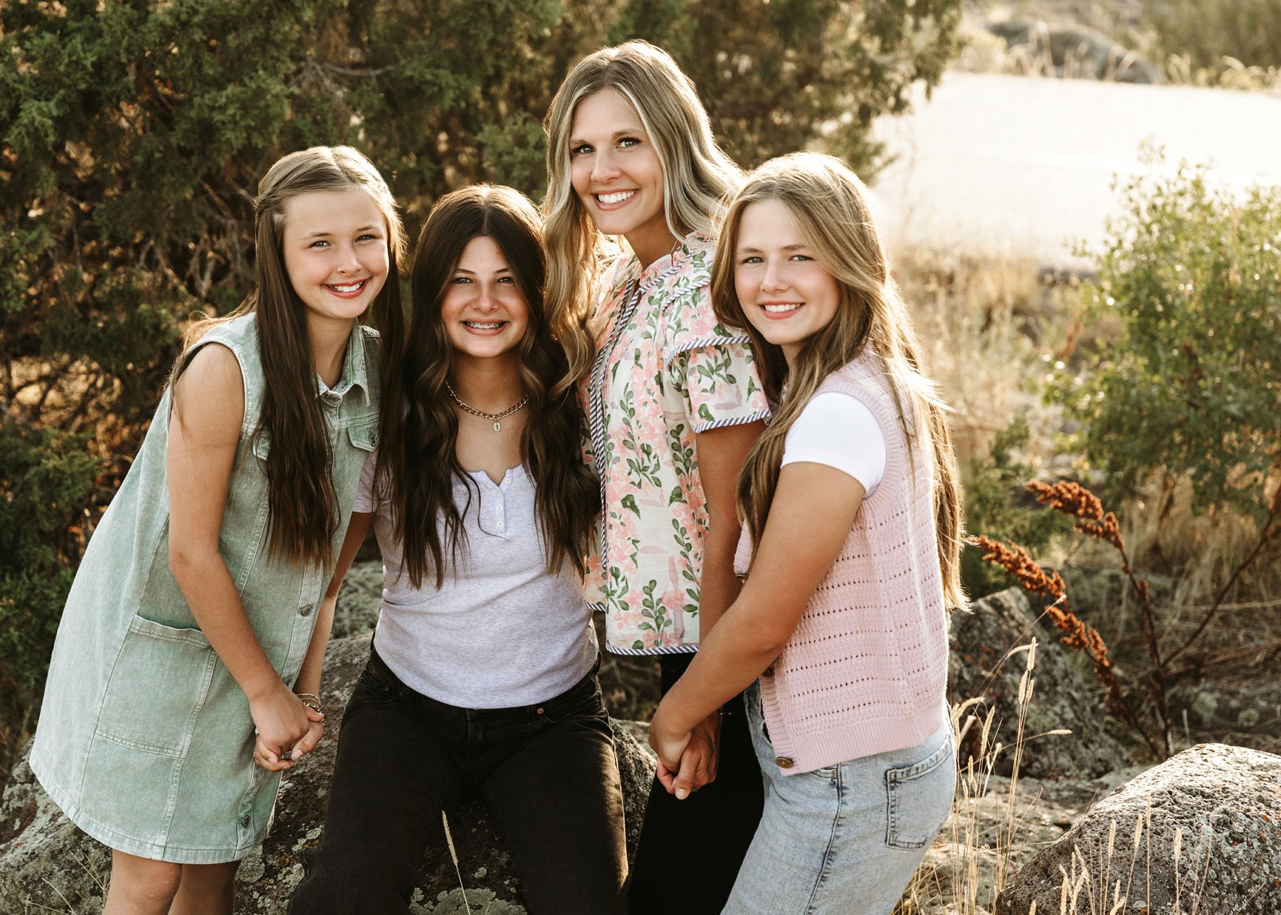 Parents and kids enjoying natural mountain backdrop
