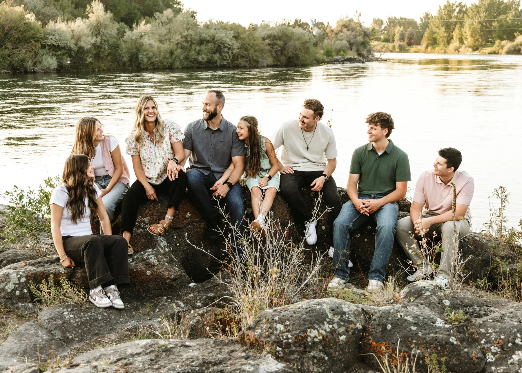 Parents watching children play during candid family photography