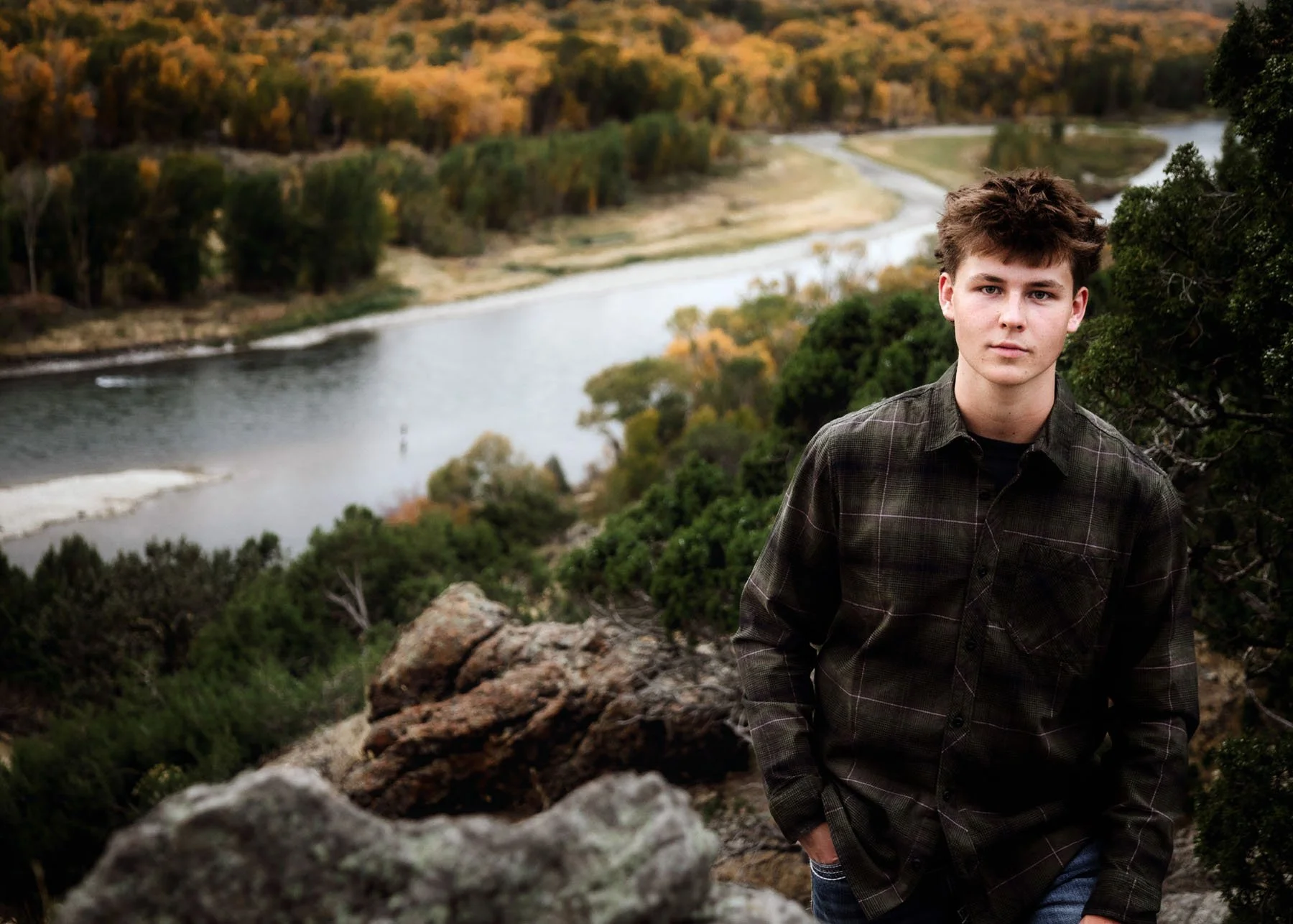  senior boys  posing on mountain with river below