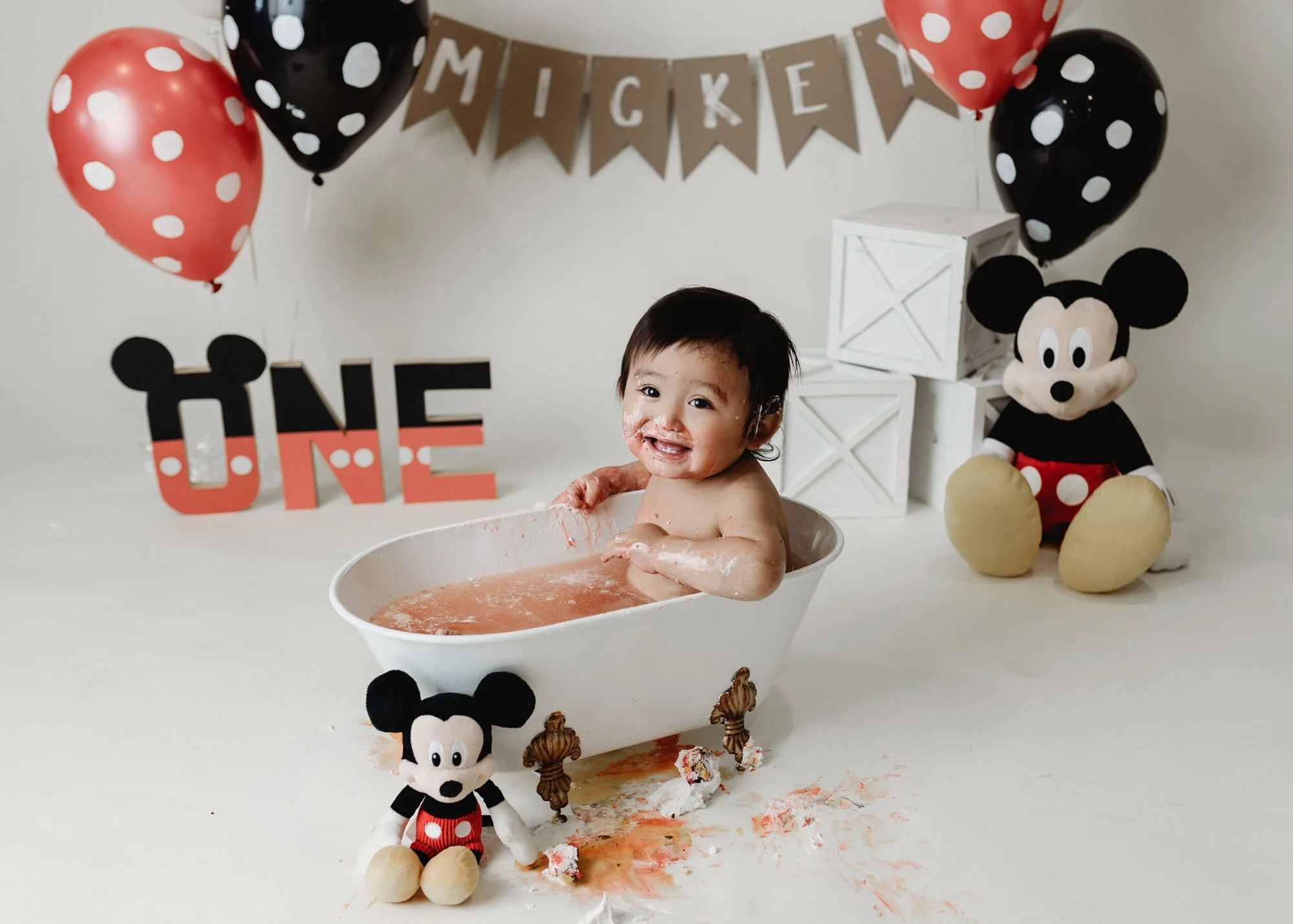 First birthday cake smash with Mickey Mouse cake and props