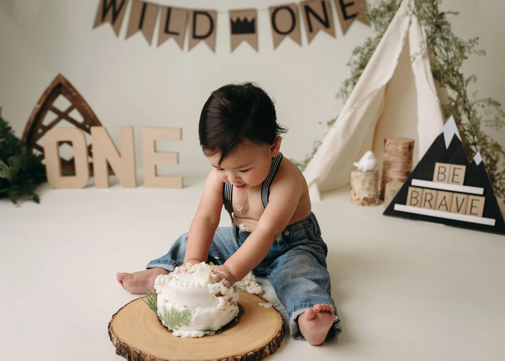White backdrop camping session with fun themed props