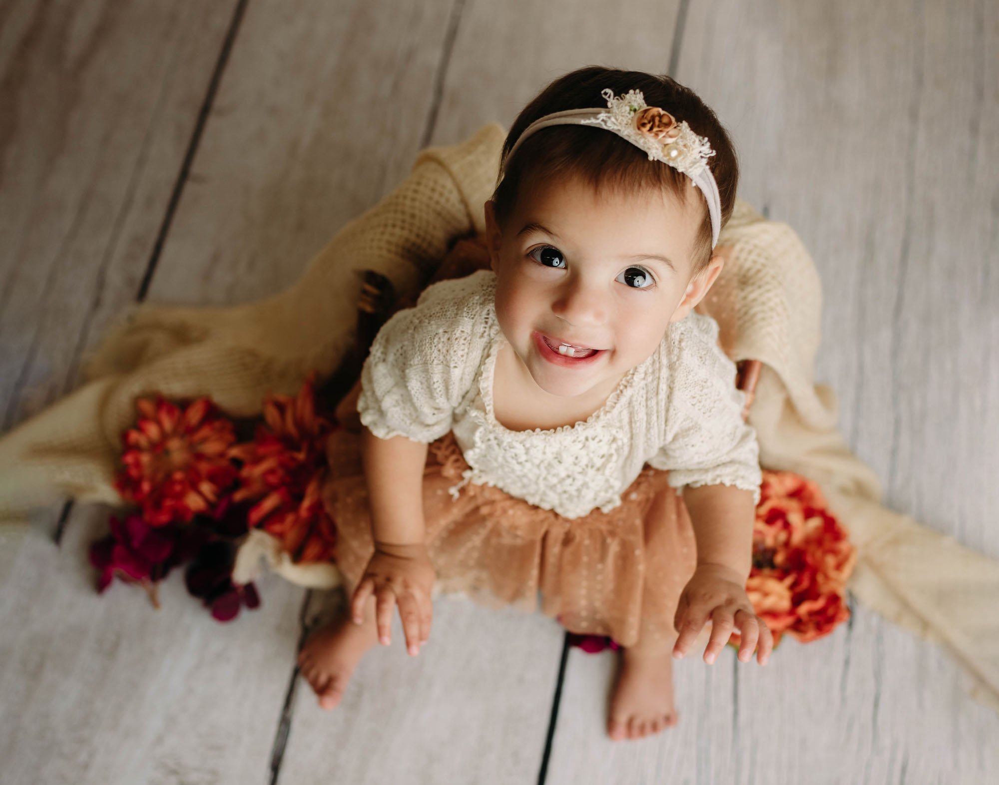 Baby milestone photo with curious expression looking up