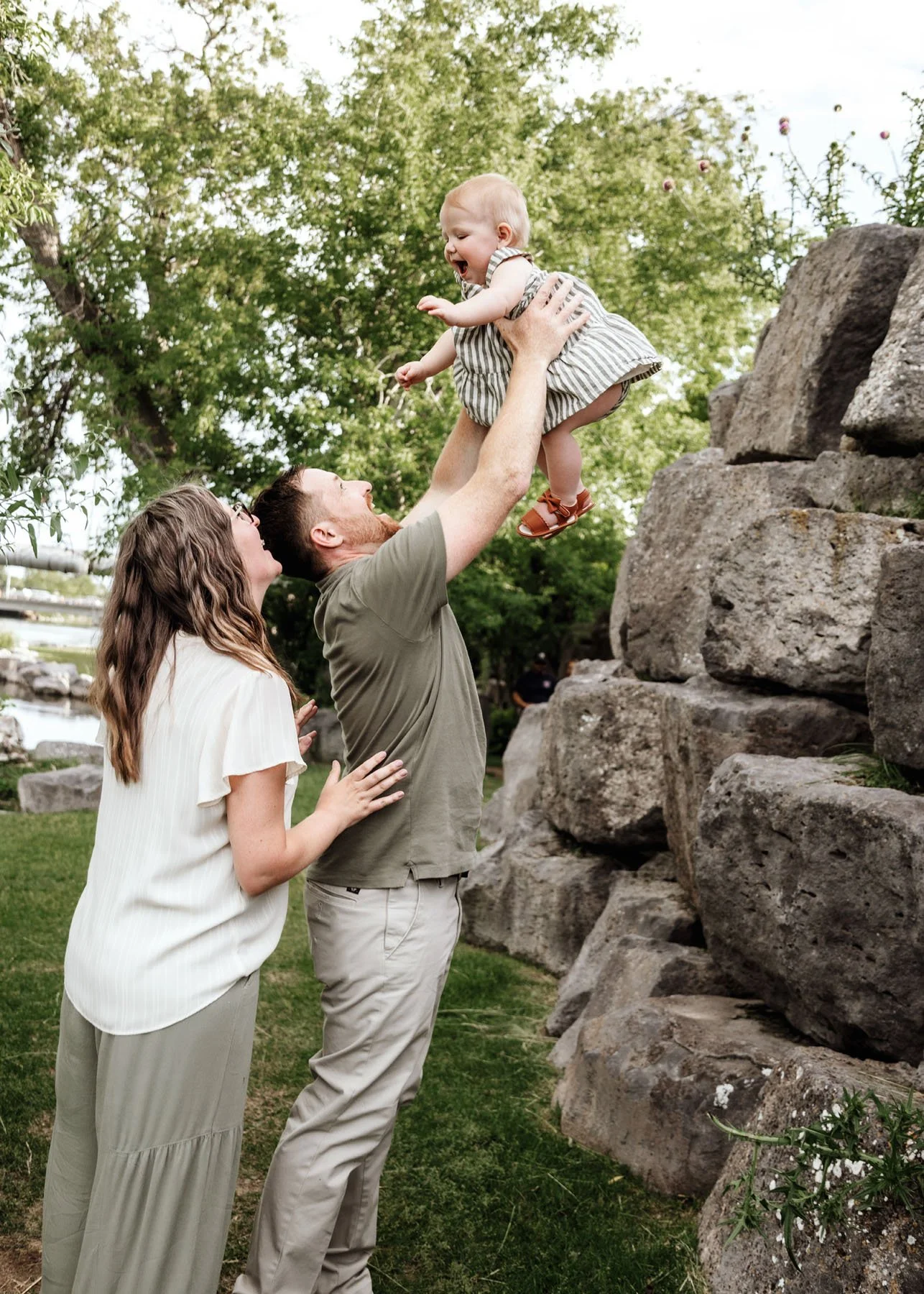 Family walking together on trail with rivers and rocks