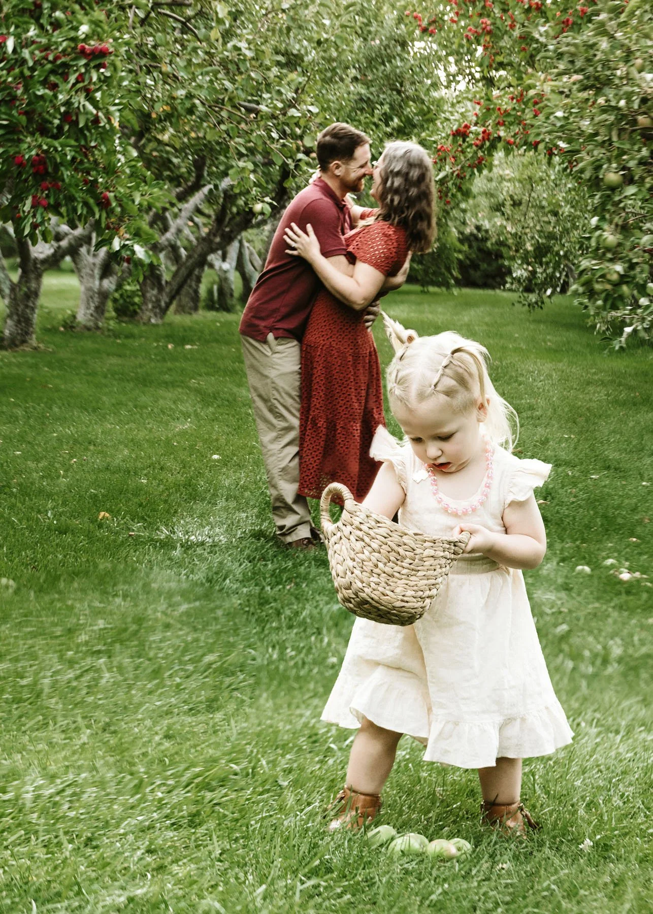 Kids running toward parents during family portrait session
