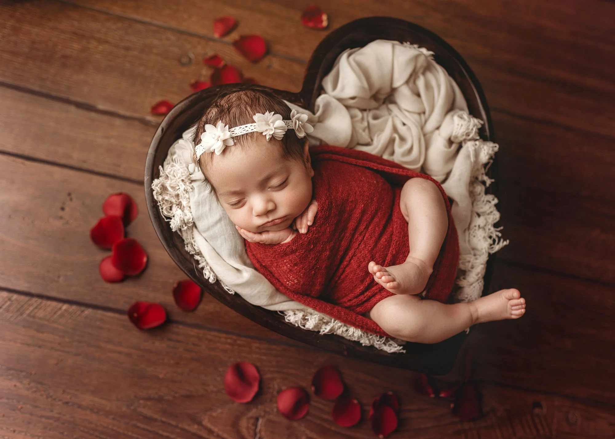 Newborn in heart bowl with Valentine inspired styling