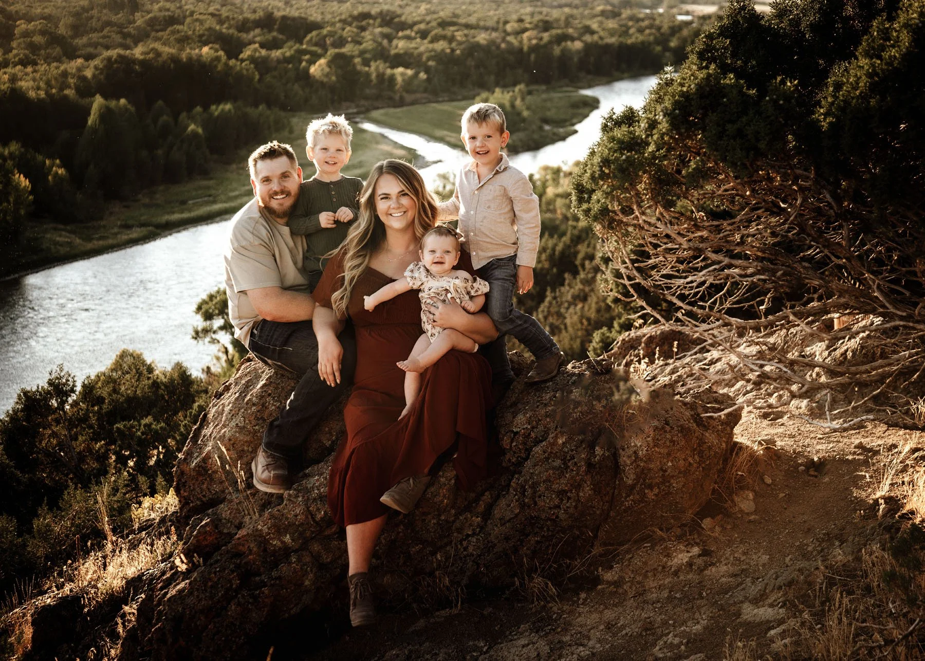 Family walking together on trail with rivers and rocks