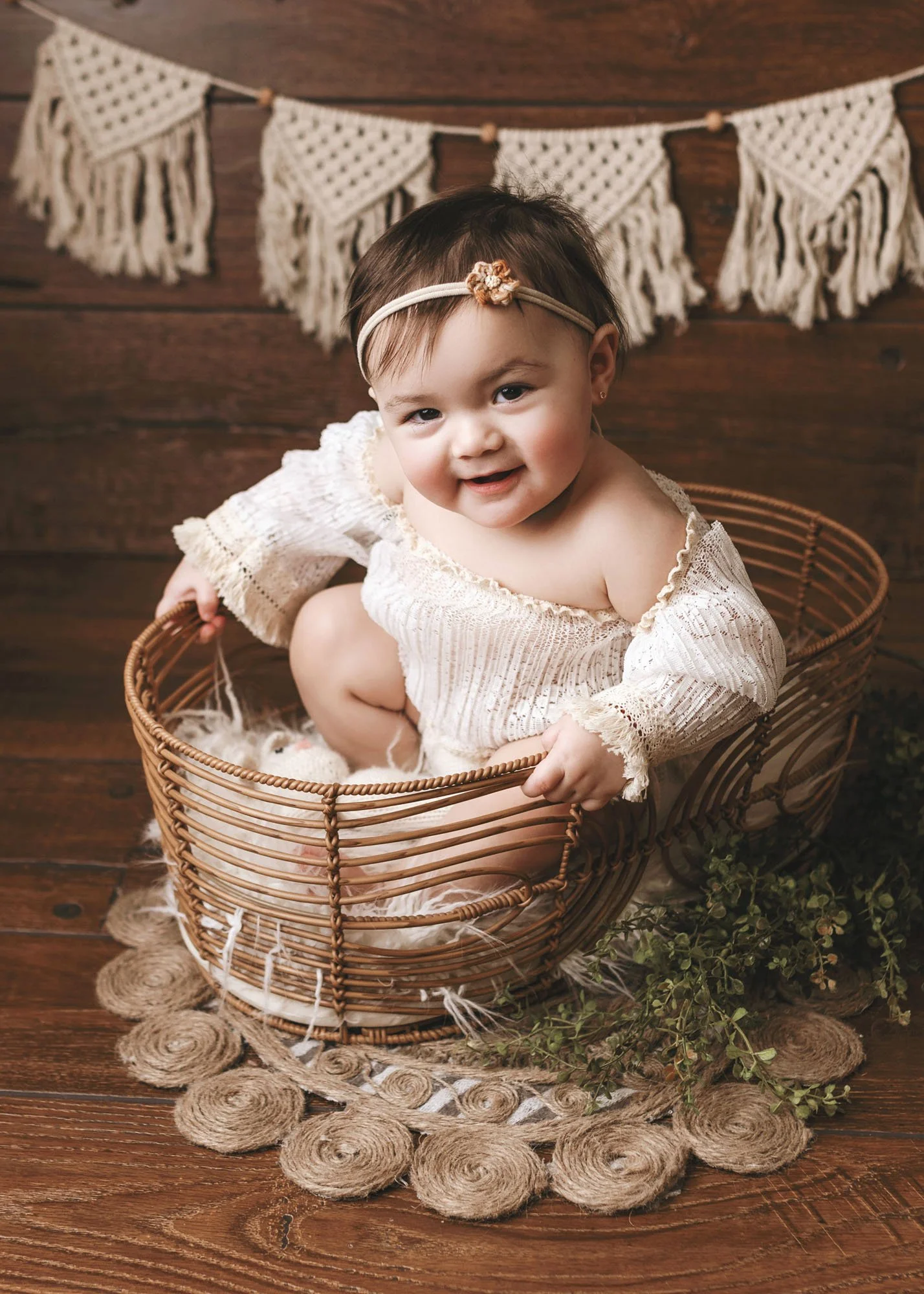 Studio milestone session with baby in Moses basket