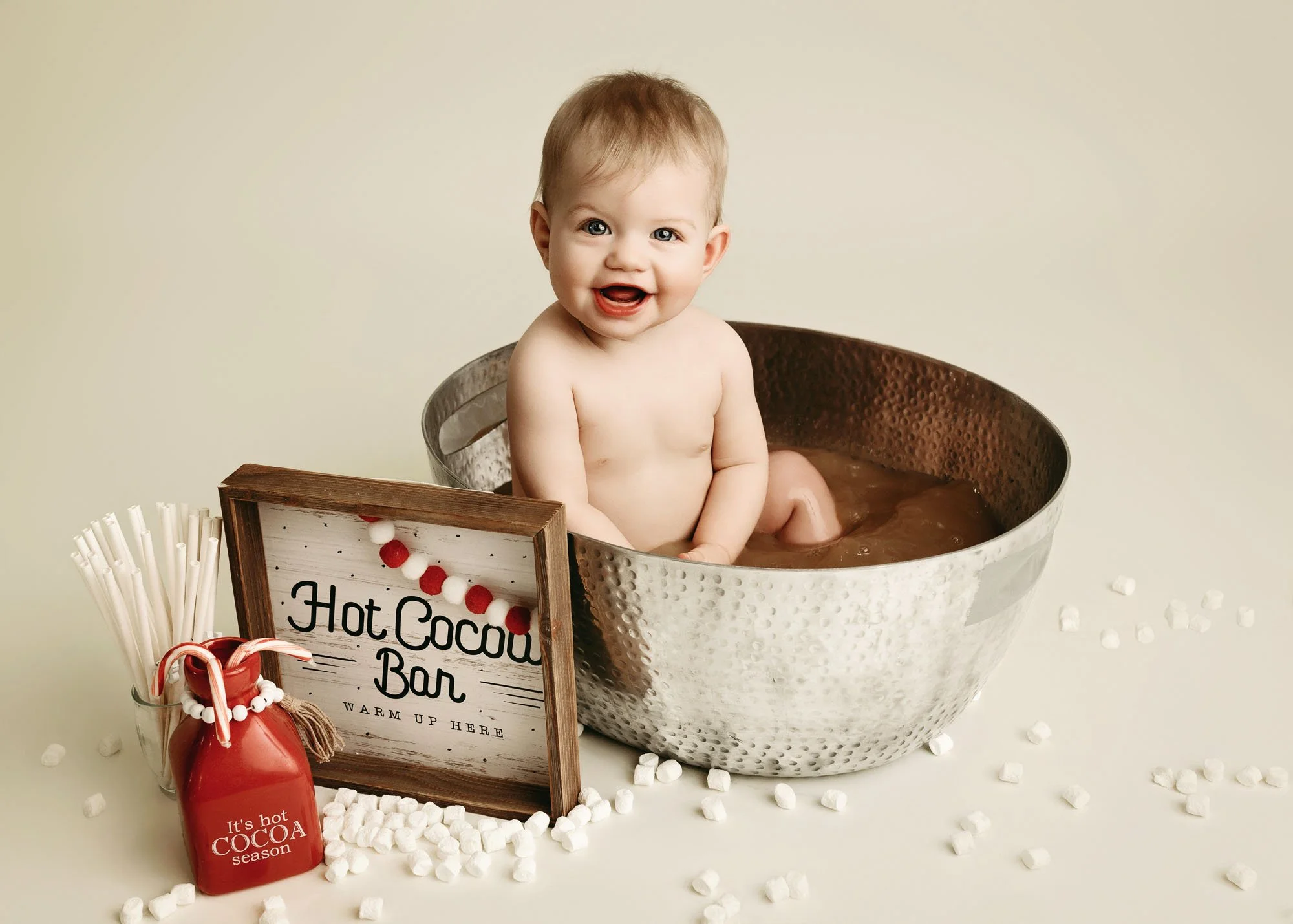 Milestone session with baby in hot chocolate tub setup