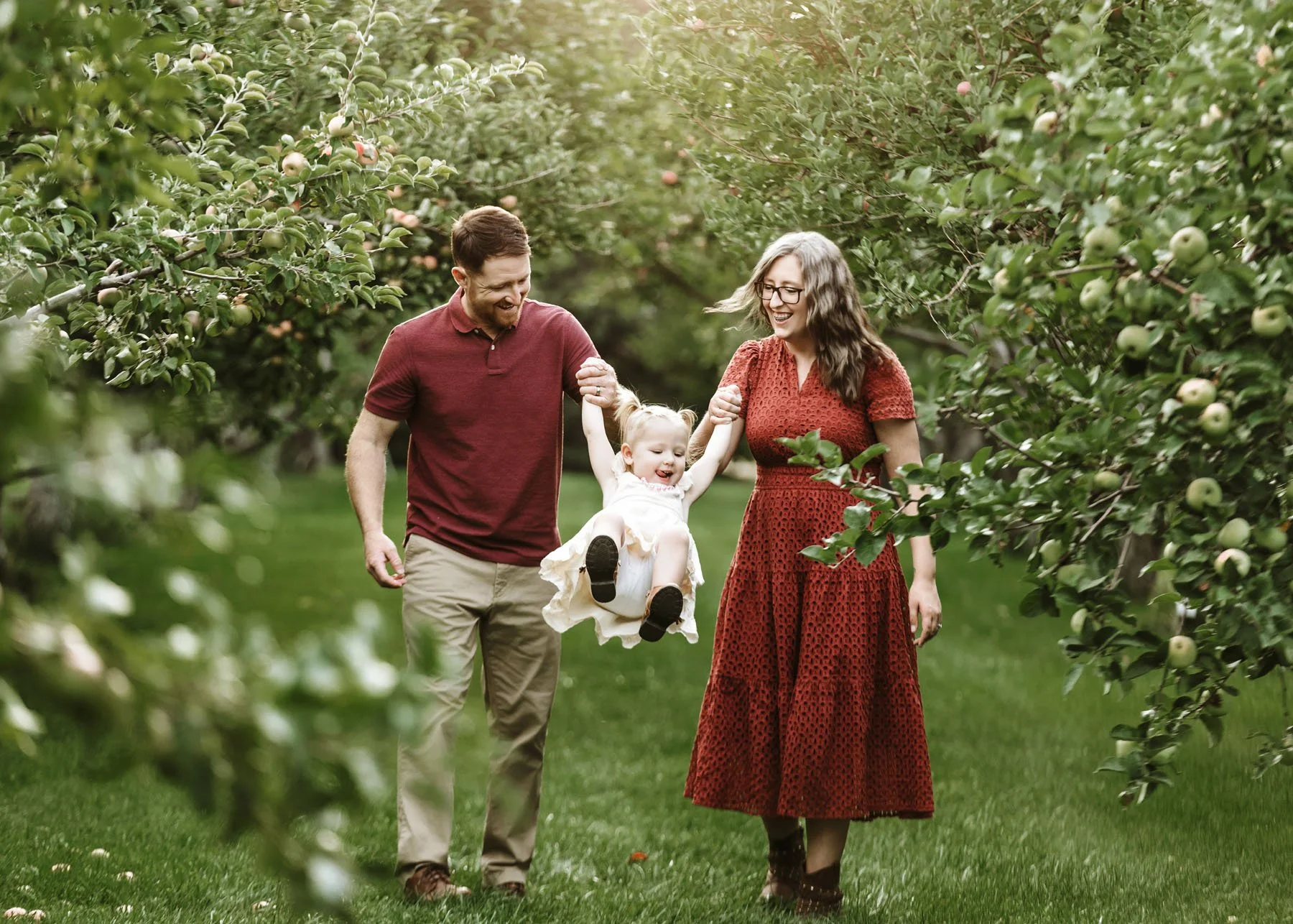 Family walking together while kids play in foreground