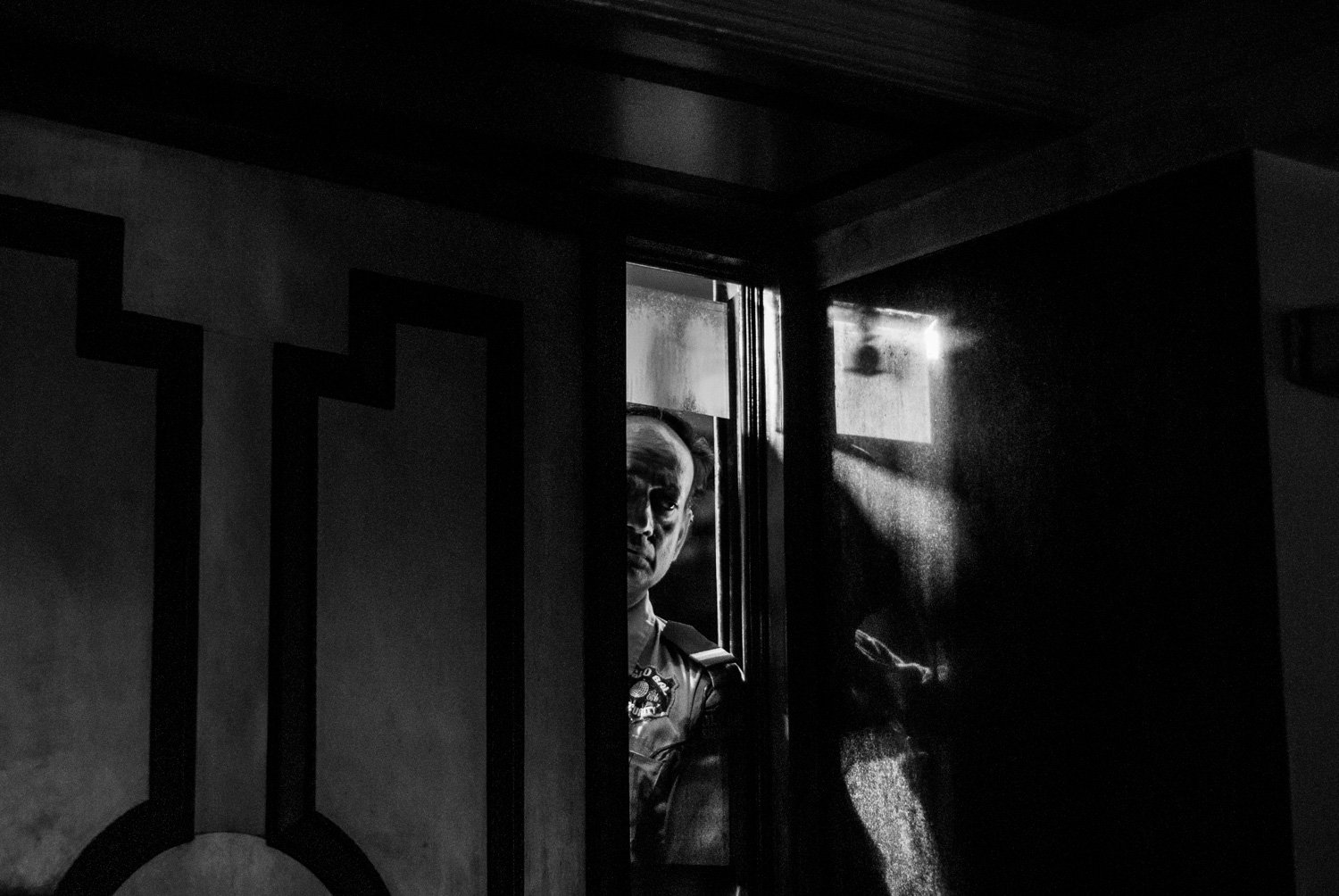 India. New Delhi. Security guard in a bar. 2008.