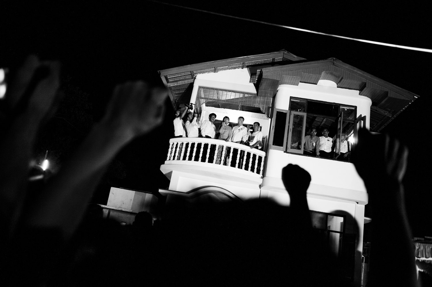 Myanmar. by-elections. Supporters of Aung San Suu Kyi gather in front of her native home south of Yangon during the 2012 by-elections.