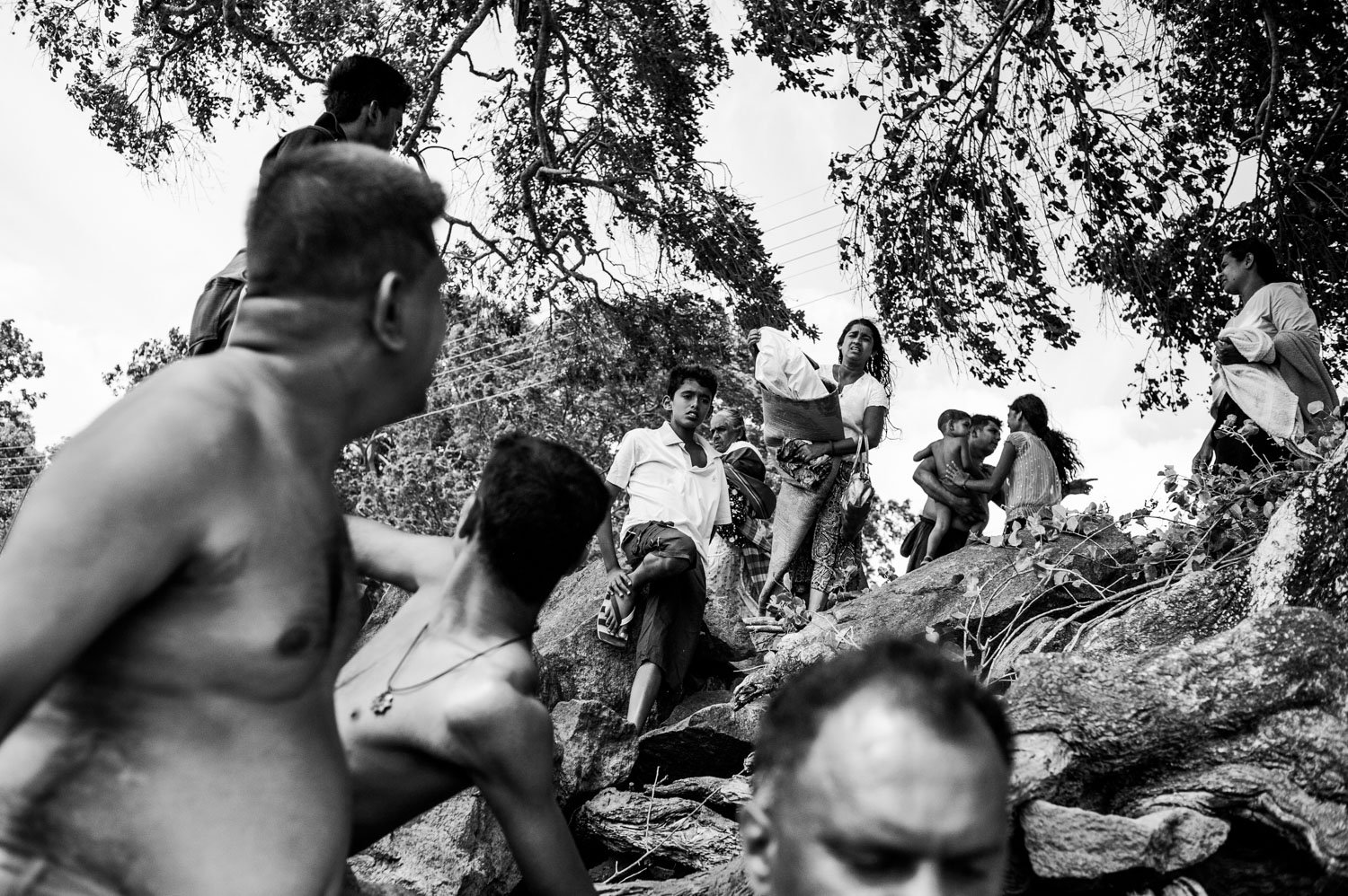 Sri Lanka. Families celebrates Poya Days, or full Moon days, on the riverside on Polonnaruwa Lake. 2009.