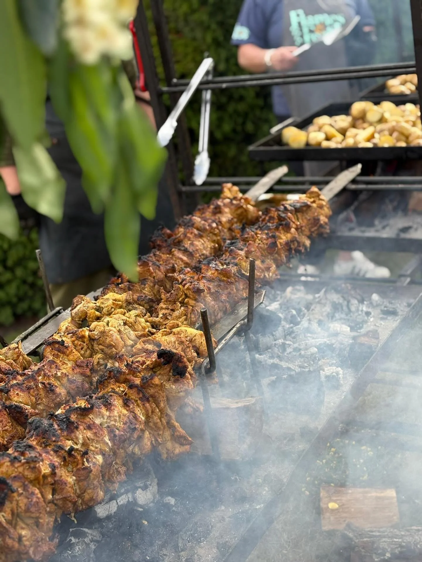 Chicken Shawarma- the most incredible Middle Eastern marinated chicken- cooked over embers on homemade giant skewers turning it into a smoky and absurdly delicious feast. We like to serve ours in homemade flatbreads, with baba ganoush, pickles &amp; 