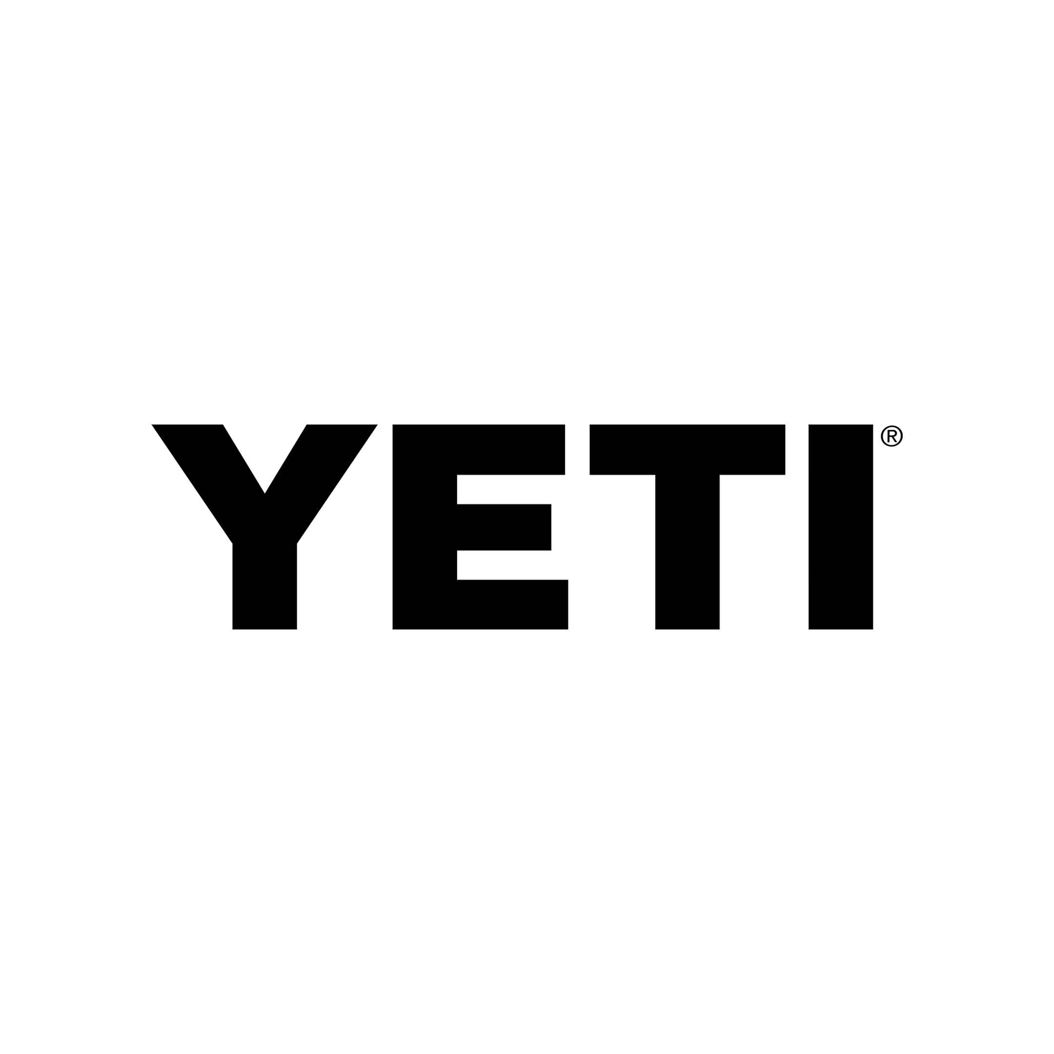 A black silhouette of a person sitting at a desk with a computer, reading a book.