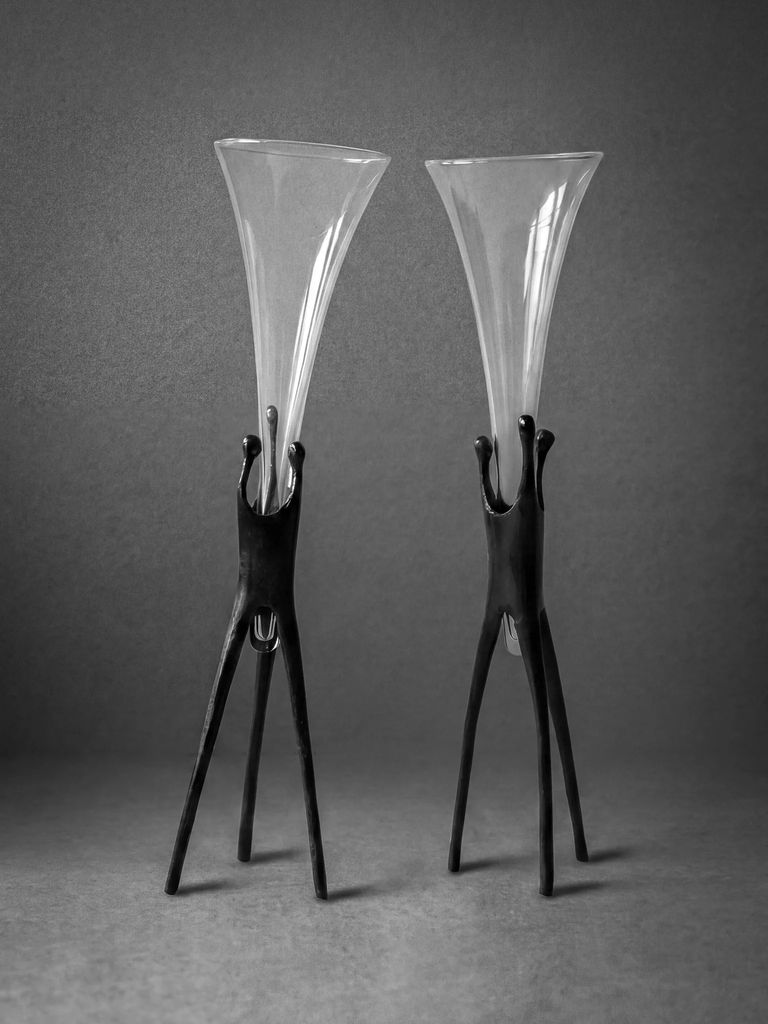 1980s champagne flutes with bronze tripod bases..jpg