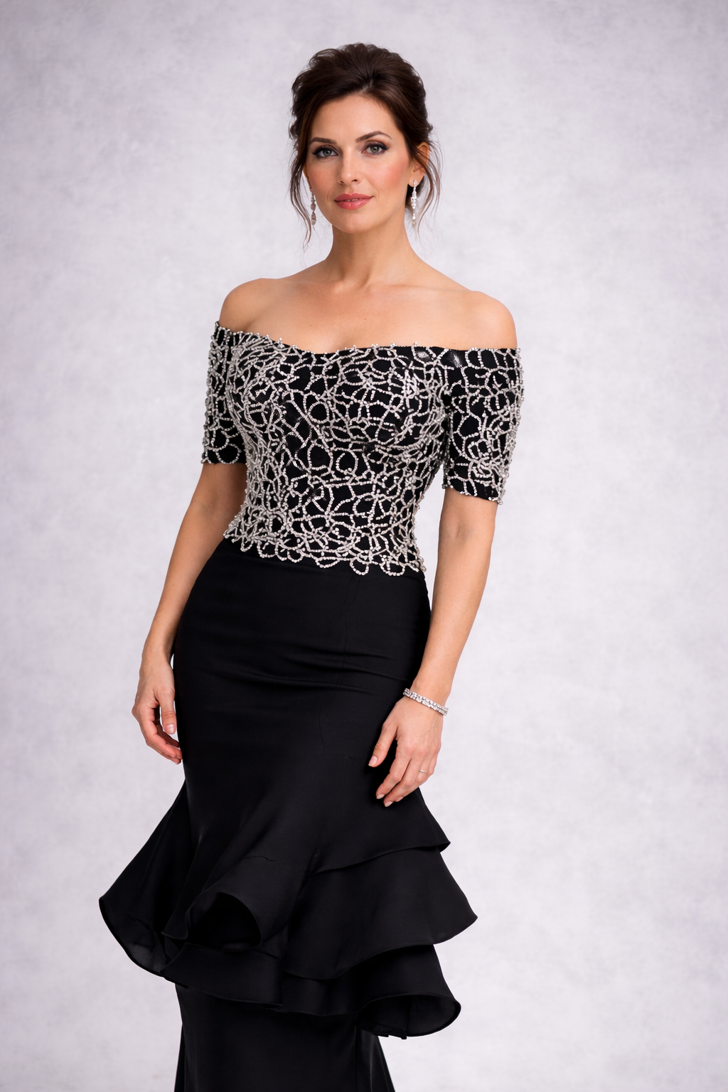 beaded corset and cap sleeve gown with a tiered silk organza skirt. Avail in black, navy, pale pink, teal, sage green and many others. can be done strapless as well. This gown is a perfect mother of the bride ensemble. 