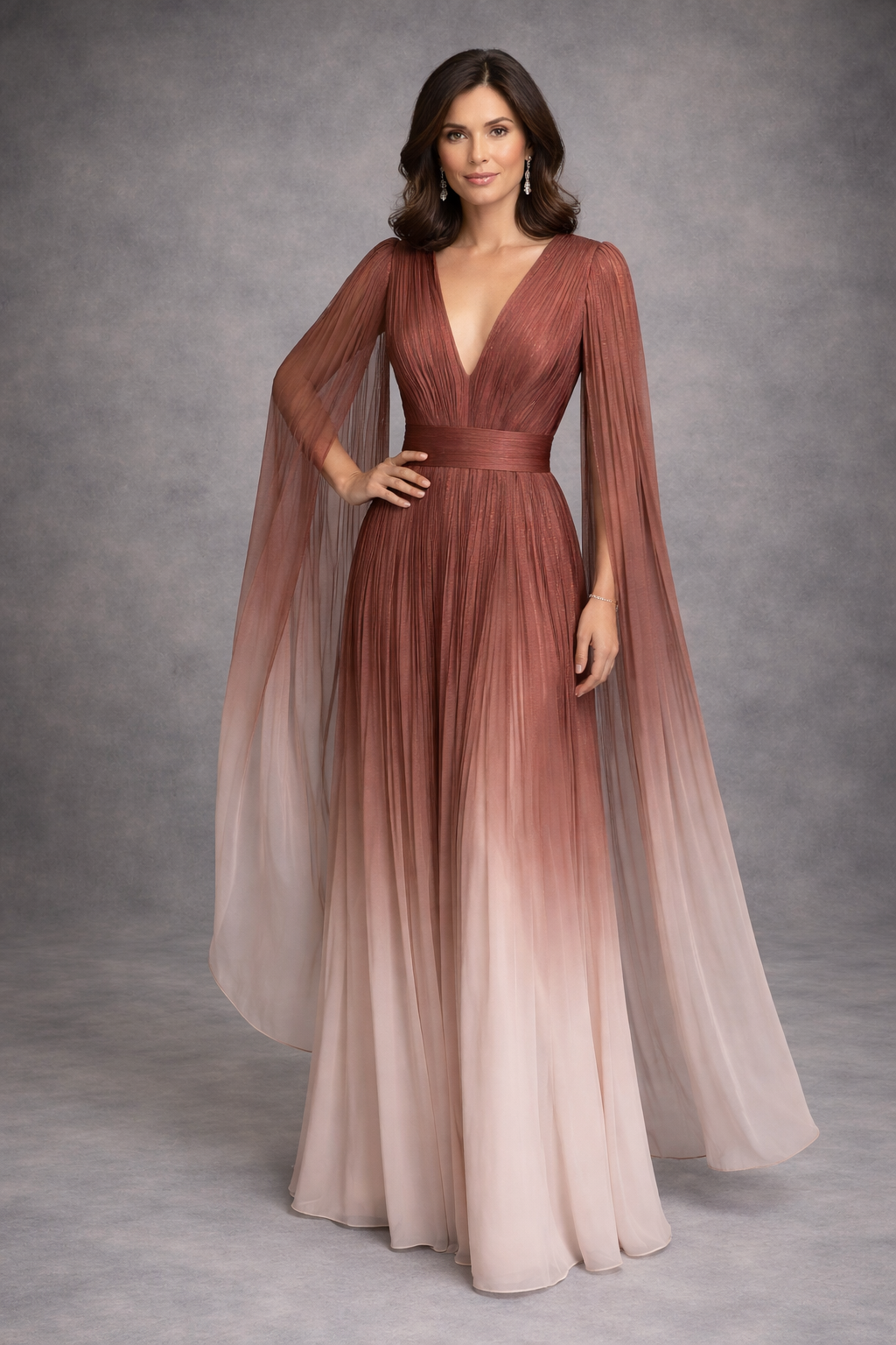 Ethereal umbrae hand painted pleated silk chiffon gown with sparkle threaded into the fabric with a deep v neckline and a flowing sleeve of pleated chiffon. The most elegant special occasion dress for any lady.
