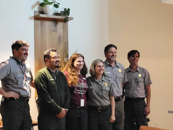   Pictured from left to right: Ranger Seth Riley (wildlife research), Ranger Antonio Solorio (SAMO Youth), SAMO Fund ED Deanna Armbruster, Ranger Mary Calverasi (Every Kid Outdoors 4th grade fieldtrips), Ranger Joey Algiers (Restoration and Native Plant Nursery), and Superintendent David Szymanski.   