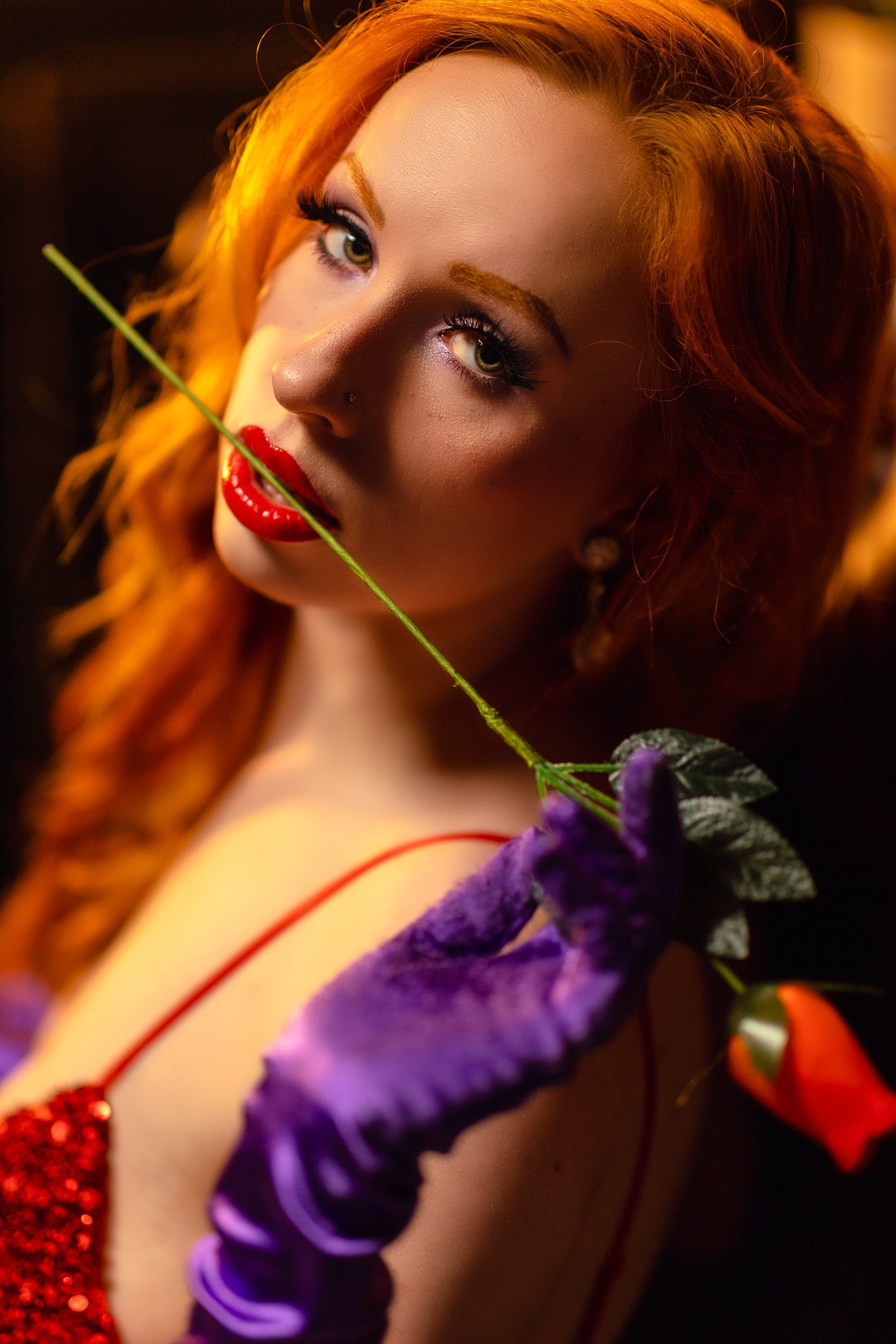 a glamour headshot photo of jessica rabbit with a rose in her mouth by photographer yohance bailey based in binghamton new york  serving ithaca syracuse upstate new york.jpg