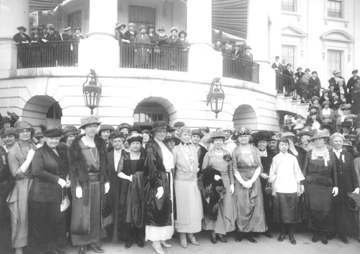 The image was taken in 1921, shortly after the August 1920 ratification of the 19th Amendment, which granted women the right to vote in the United States. It was during this period in 1923 that Alice Paul first introduced the Equal Rights Amendment (