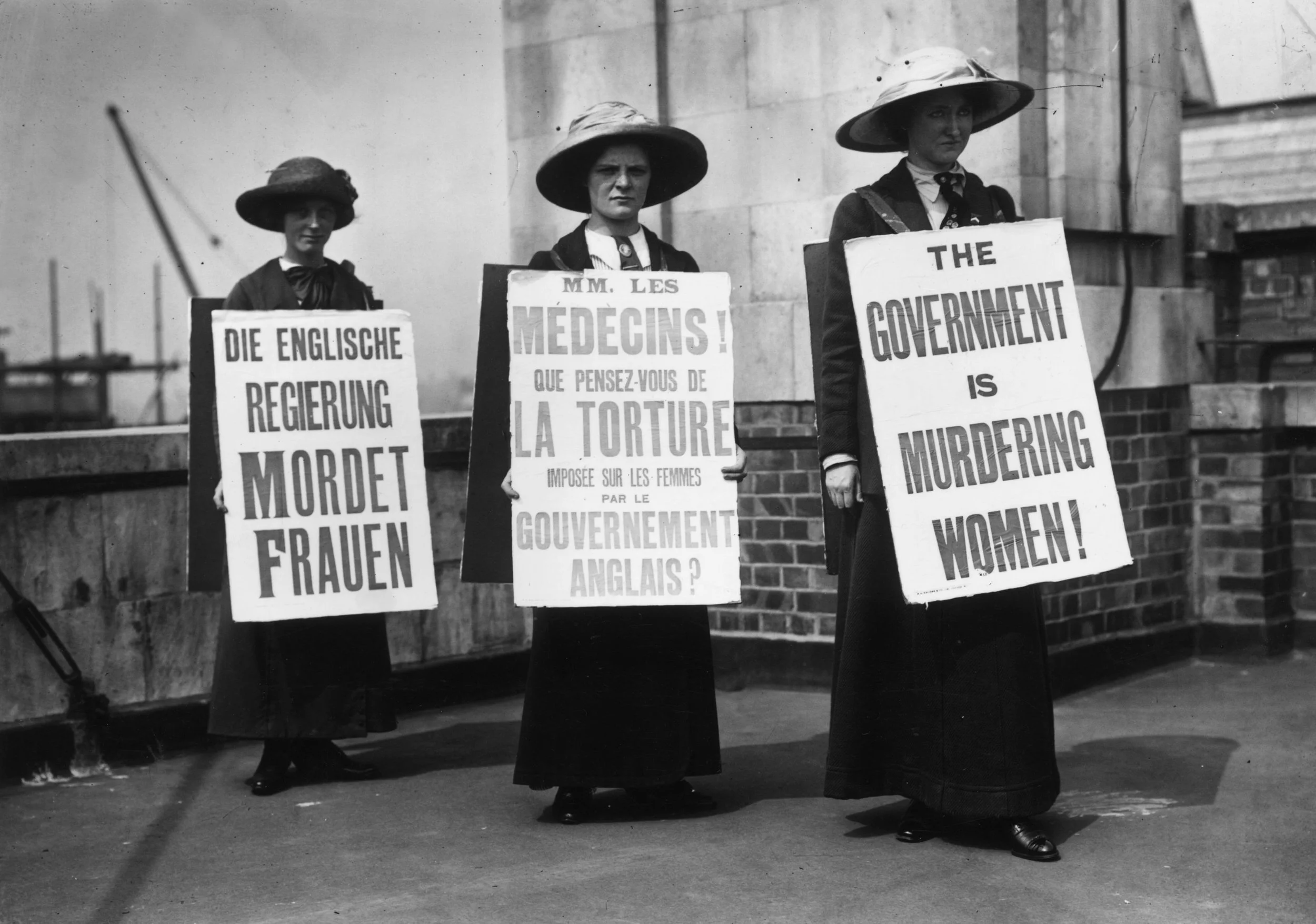 The image, captured on August 12, 1913, shows three women from the militant [Women's Social and Political Union (WSPU)](1.2.6, 1.2.8) wearing sandwich boards. 