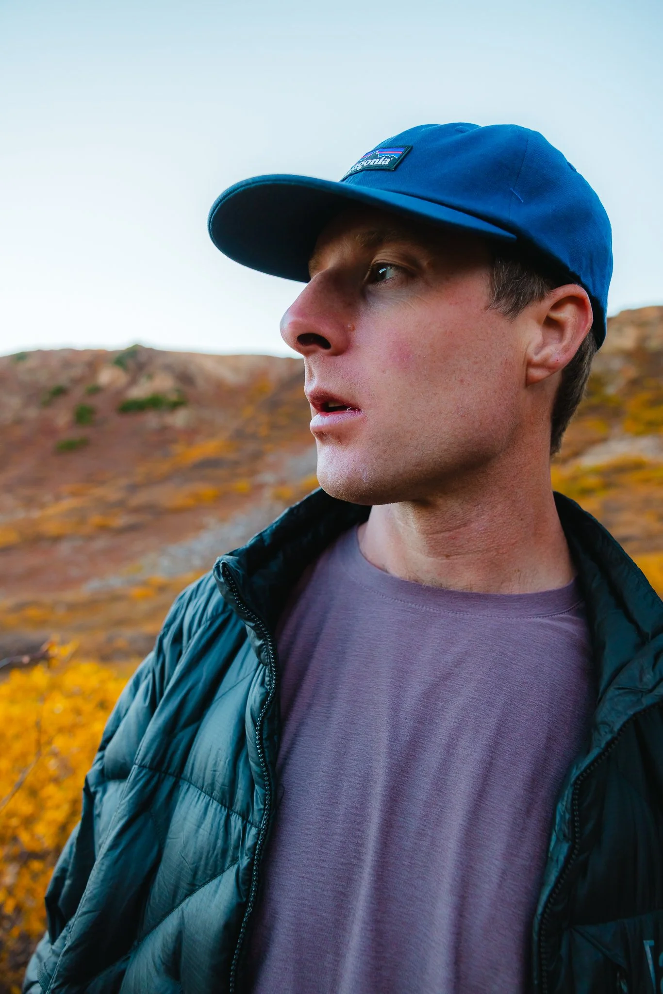 wearing a Patagonia hat and Burton Puffy down jacket