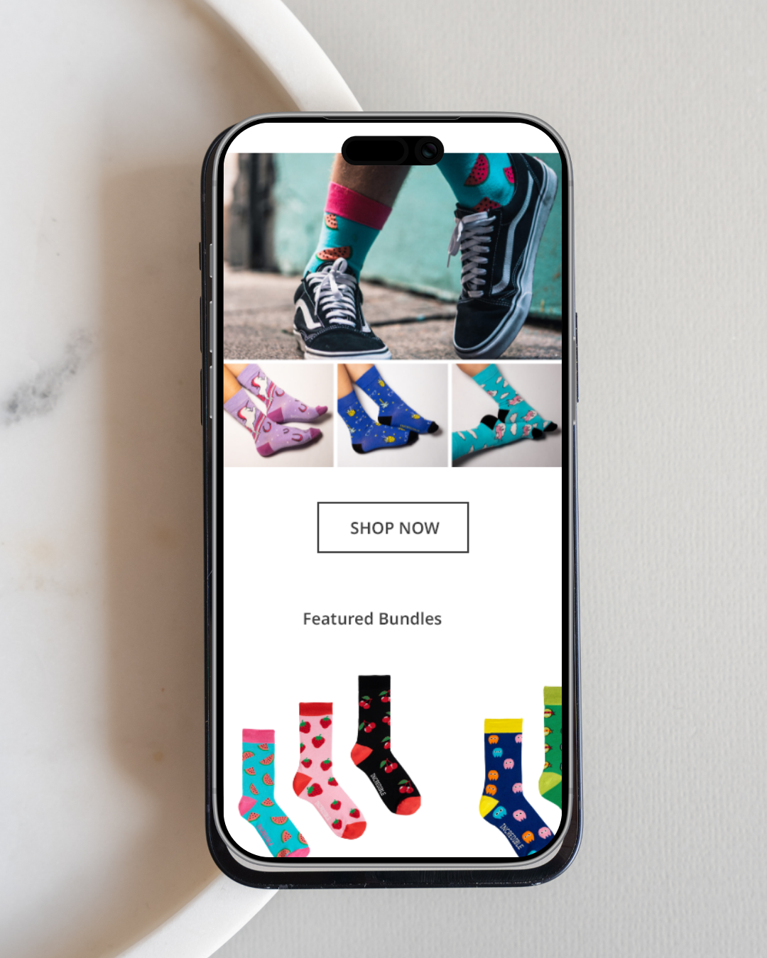 Incredible Socks ecommerce website displayed on mobile with a responsive shopping experience.