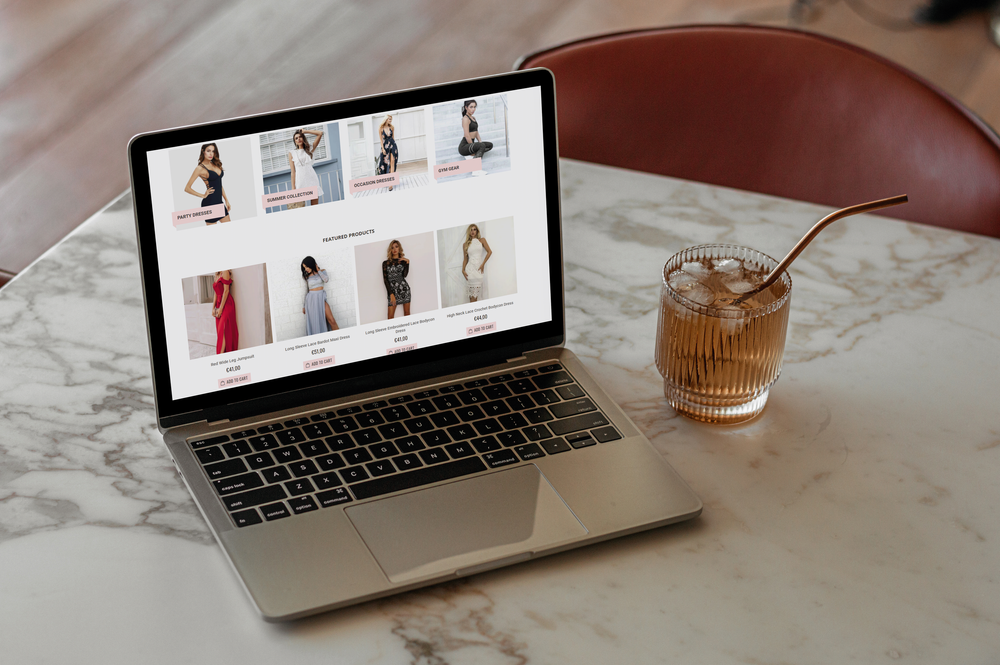 Poise Club fashion e-commerce website displayed on a laptop, showing product categories and featured clothing.