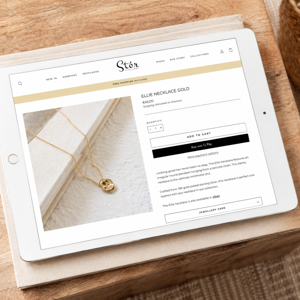 Stór Jewellery Ellie Necklace product page displayed on a tablet on a wooden table
