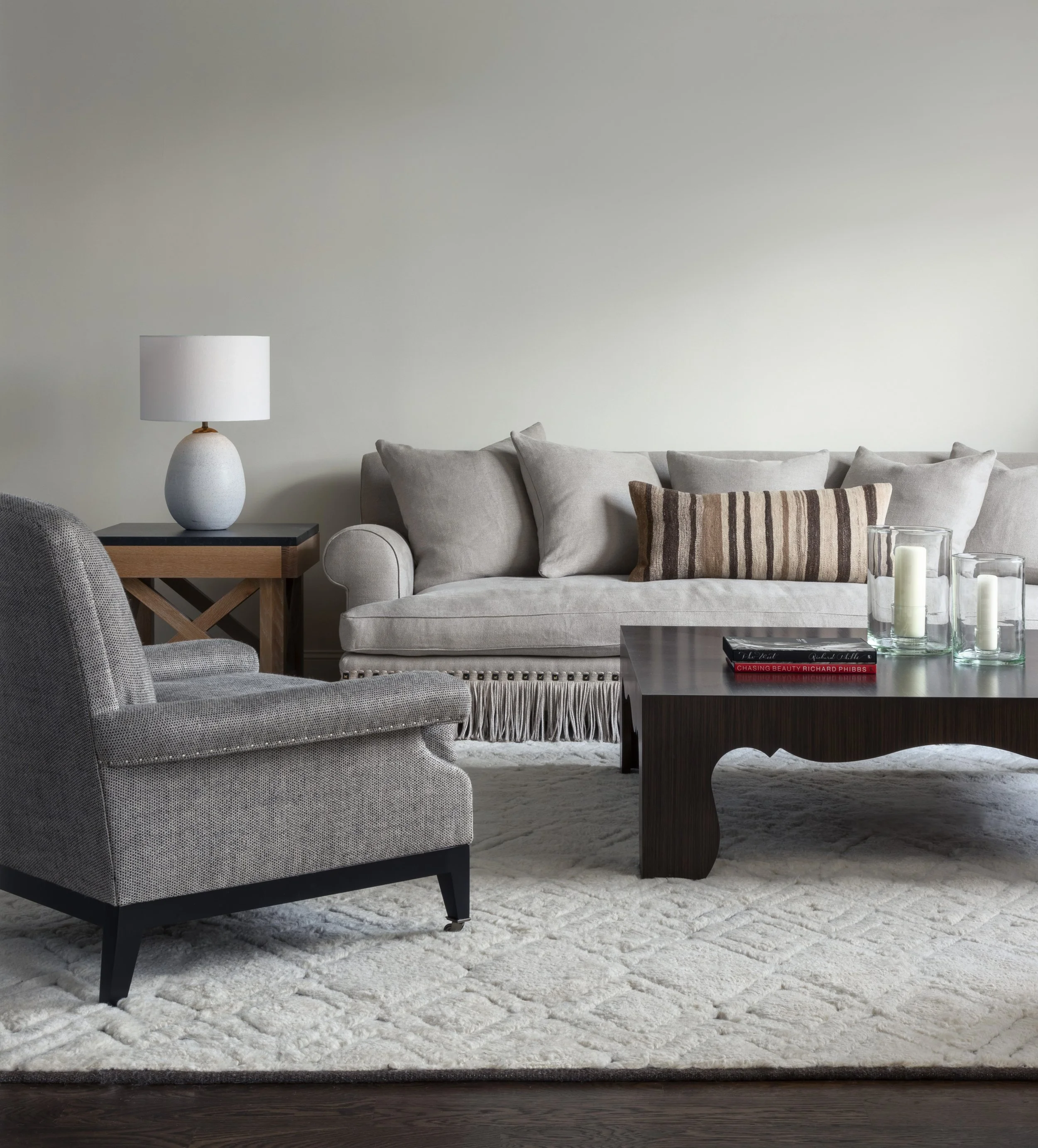 simple monochromatic livingroom sofa with fringe.jpg