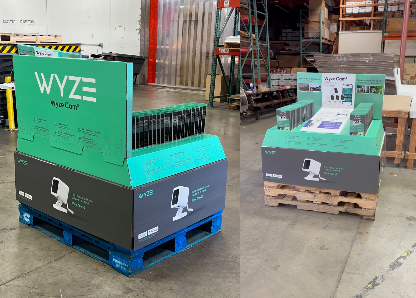 Display of WYZE Cam products in a warehouse, with cameras arranged on a table and promotional signage showing features and images of the cameras.