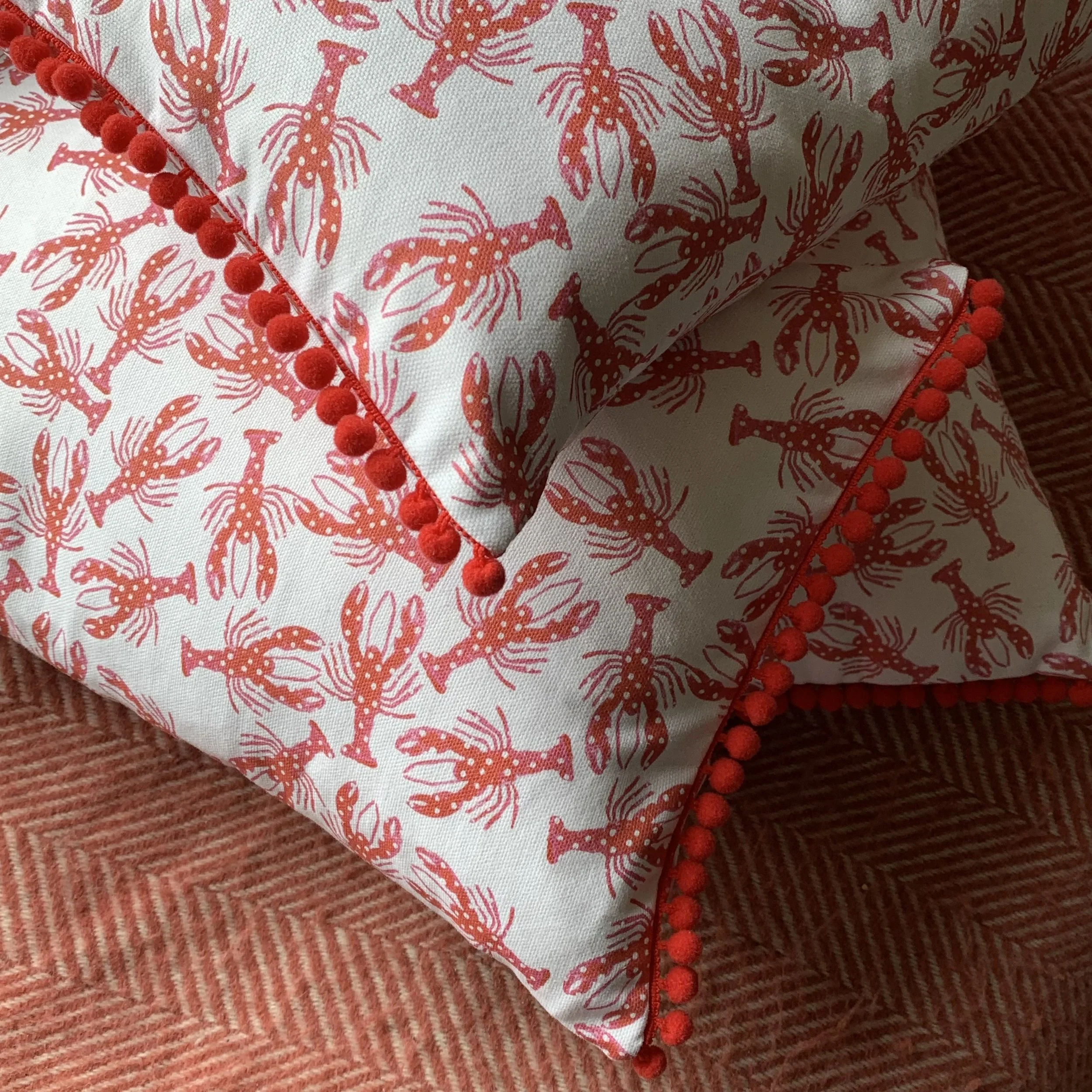Cushion with lobster pattern in red