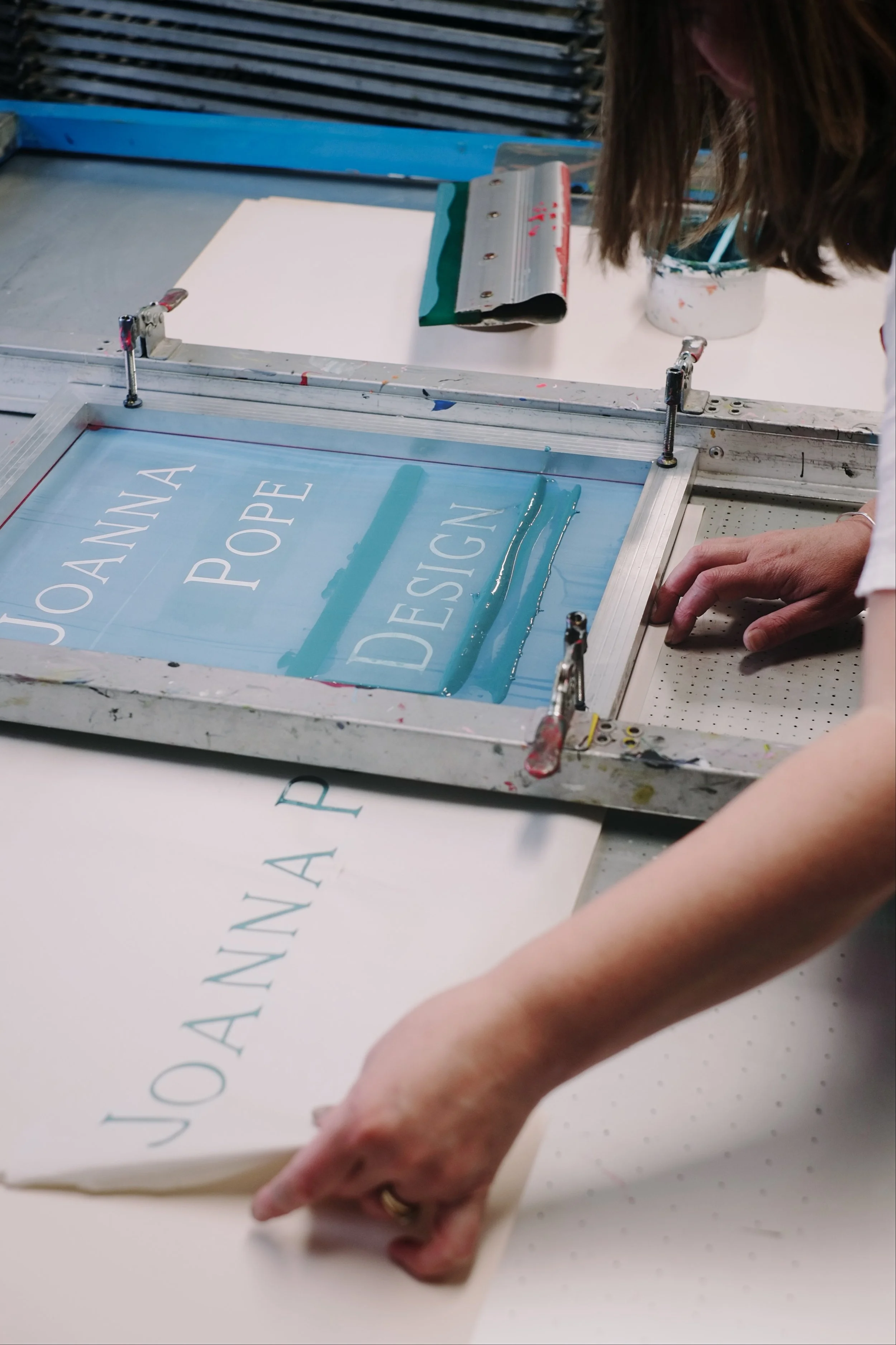 Joanna Pope Design logo being screen printed in the studio by hand
