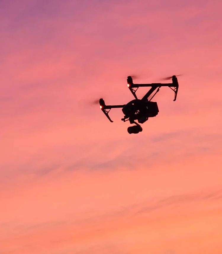 Inspire drone in flight against a pink sky at dusk