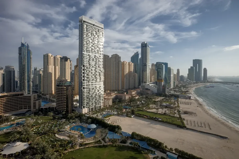Aerial view of high-rise towers along the beachfront in Dubai