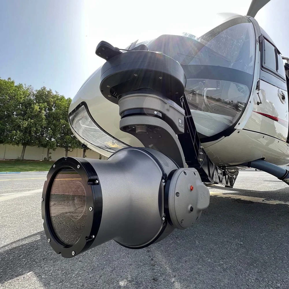 Close-up of the Phase One 100 MP camera in its gyro-stabilised head under a helicopter