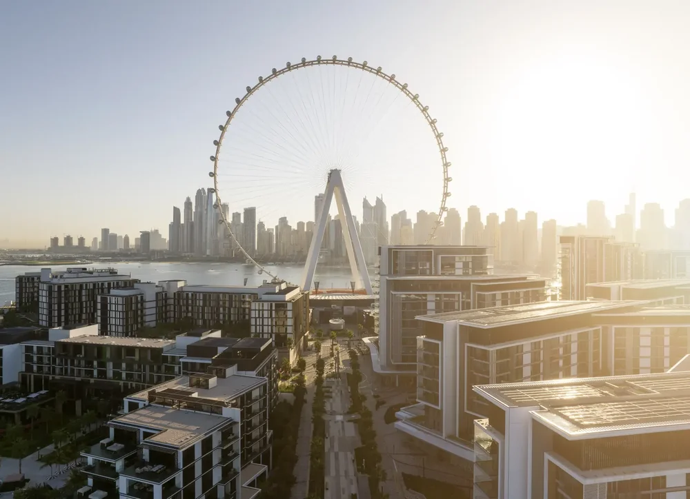 Aerial view of the Bluewaters Island residences and Ain Dubai in golden morning light