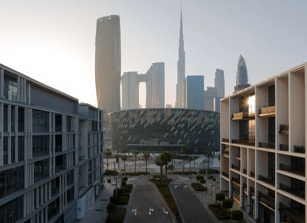 Aerial view between modern buildings towards the Burj Khalifa and the Downtown Dubai skyline