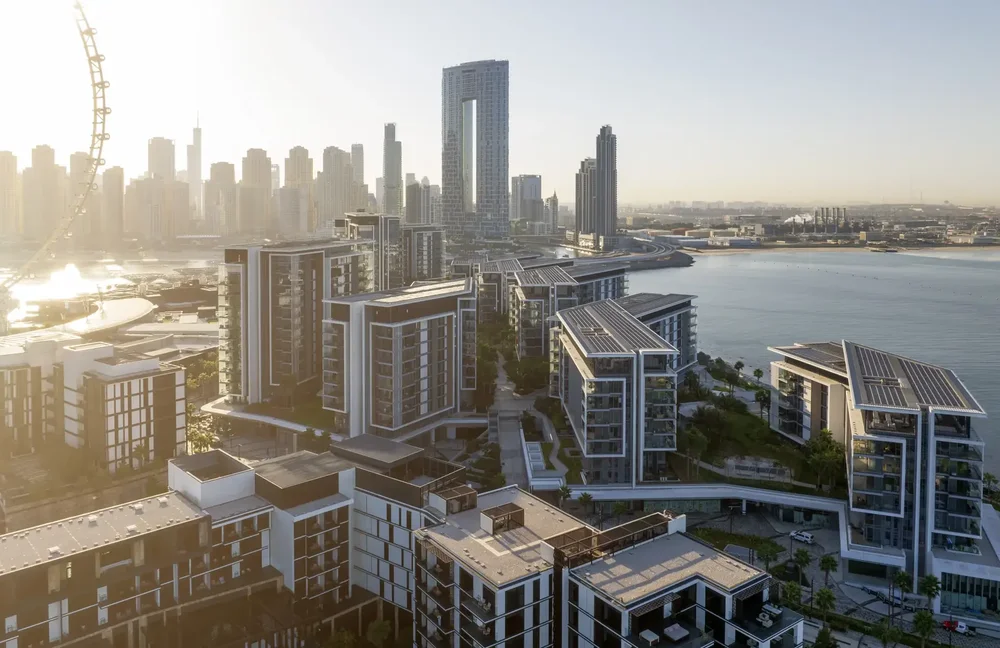 Aerial view over Bluewaters Island towards the Dubai Marina skyline in the morning