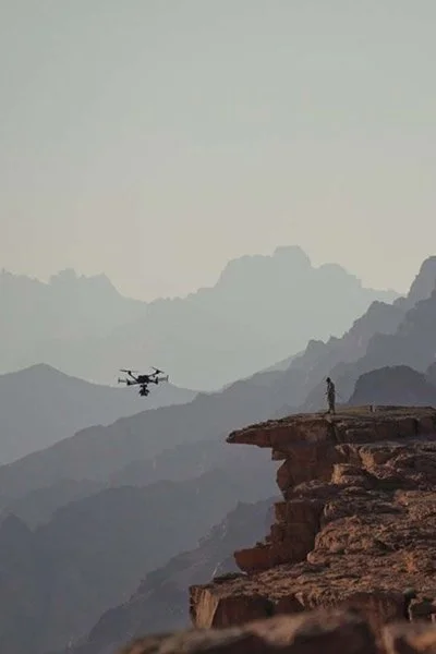 Drone flying over a canyon in the mountains of Tabuk, Saudi Arabia